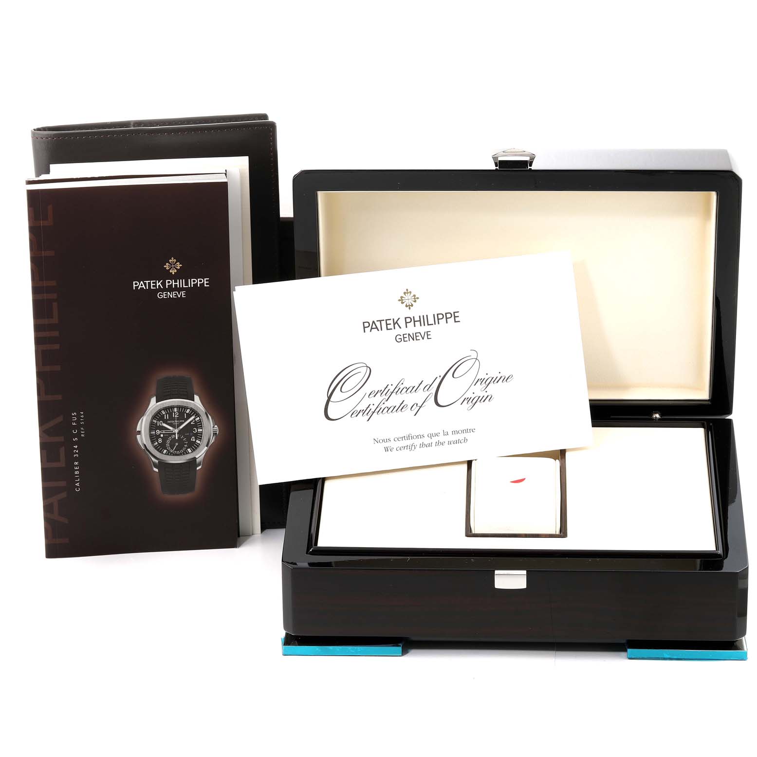 The image shows the packaging and documentation, including the certificate of origin, for a Patek Philippe Aquanaut 5164 Men's Stainless Steel Black Dial 5164 Men's Stainless Steel Black Dial watch.