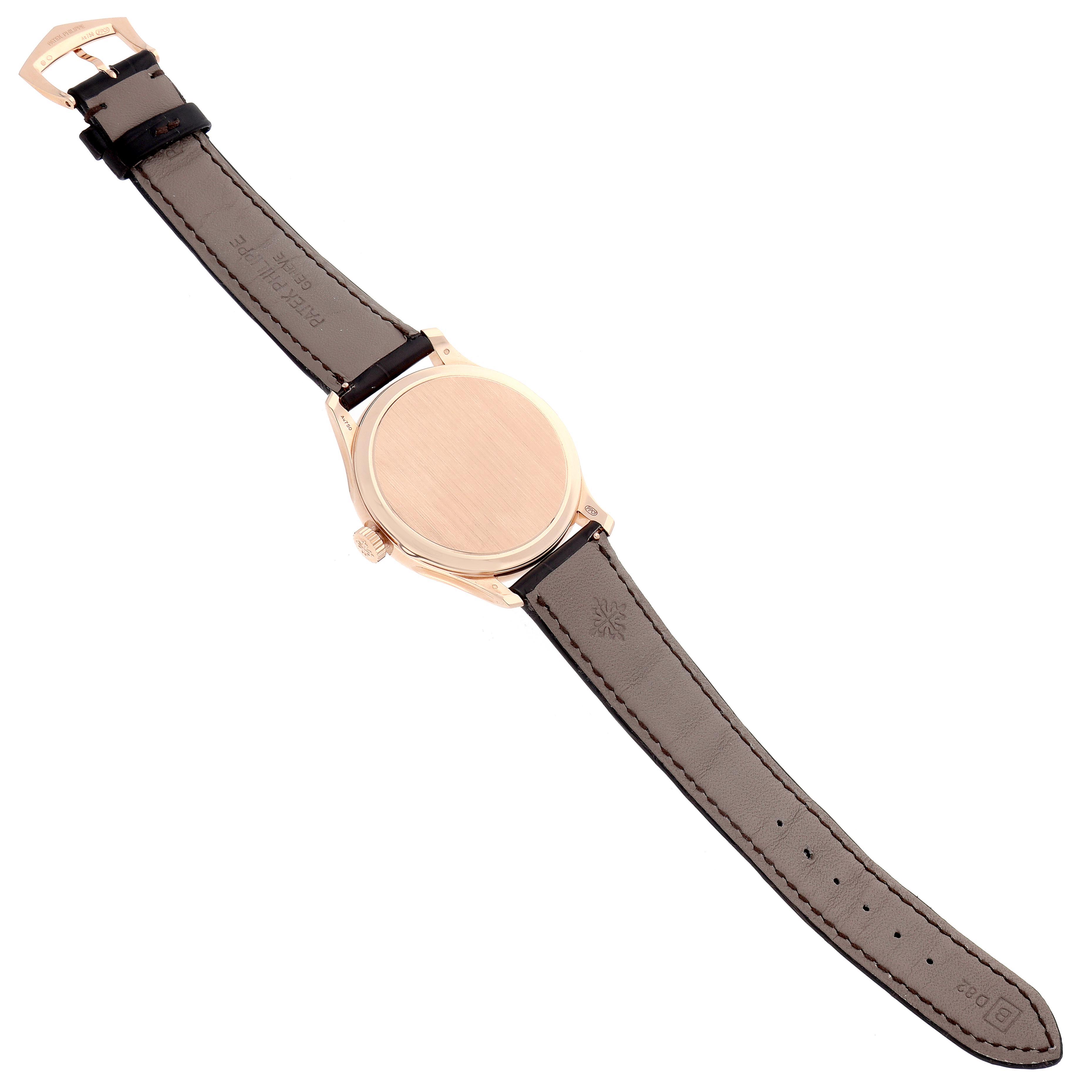 The Patek Philippe Calatrava 5227R-001 Men's Rose Gold White Dial 5227R-001 Men's Rose Gold White Dial watch is shown from the back, displaying the case back, crown, and full leather strap.