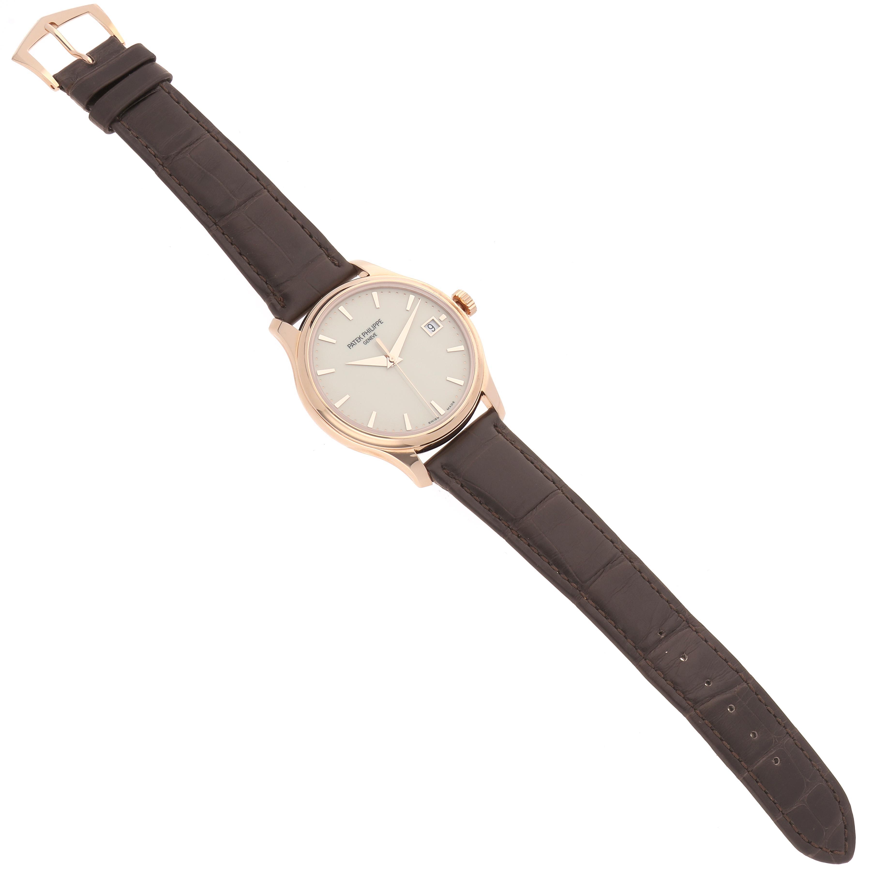 The Patek Philippe Calatrava 5227R-001 Men's Rose Gold White Dial 5227R-001 Men's Rose Gold White Dial watch is shown from above, displaying the face, strap, and buckle.