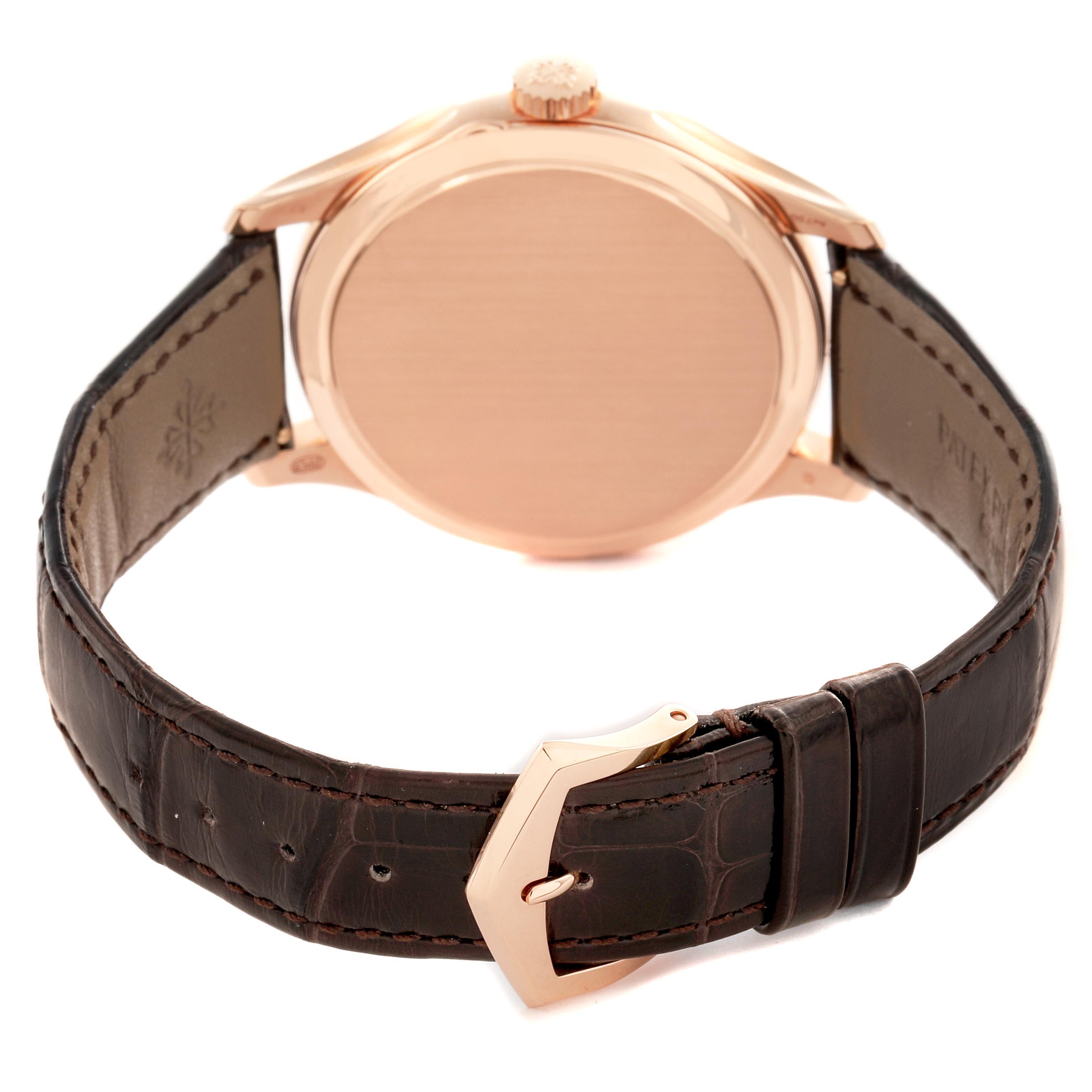 The image shows the back and side view of a Patek Philippe Calatrava 5227R-001 Men's Rose Gold White Dial 5227R-001 Men's Rose Gold White Dial watch, highlighting the case back, crown, and leather strap with buckle.