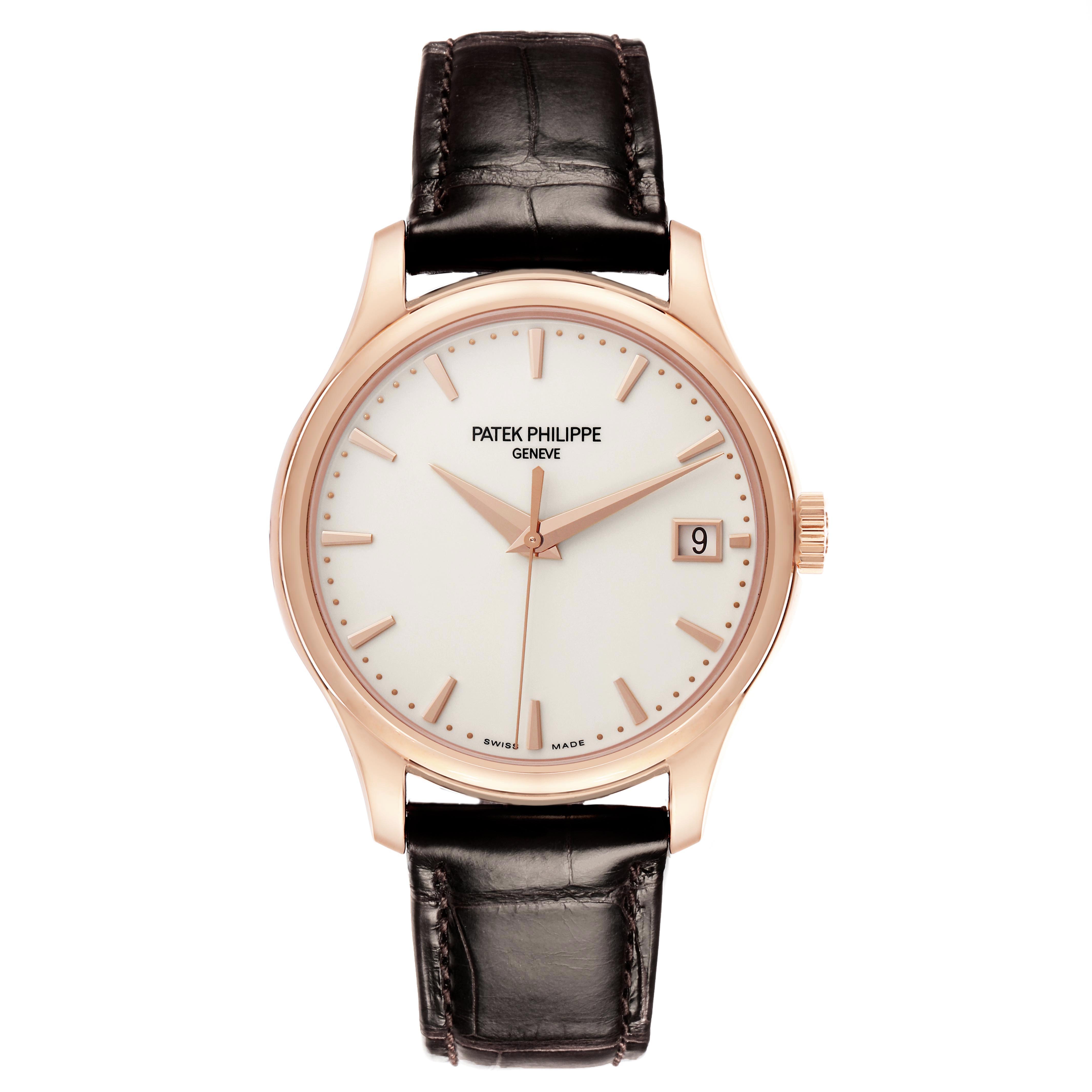 The Patek Philippe Calatrava 5227R-001 Men's Rose Gold White Dial 5227R-001 Men's Rose Gold White Dial watch is shown from a front angle, displaying the dial, hands, crown, and leather strap.