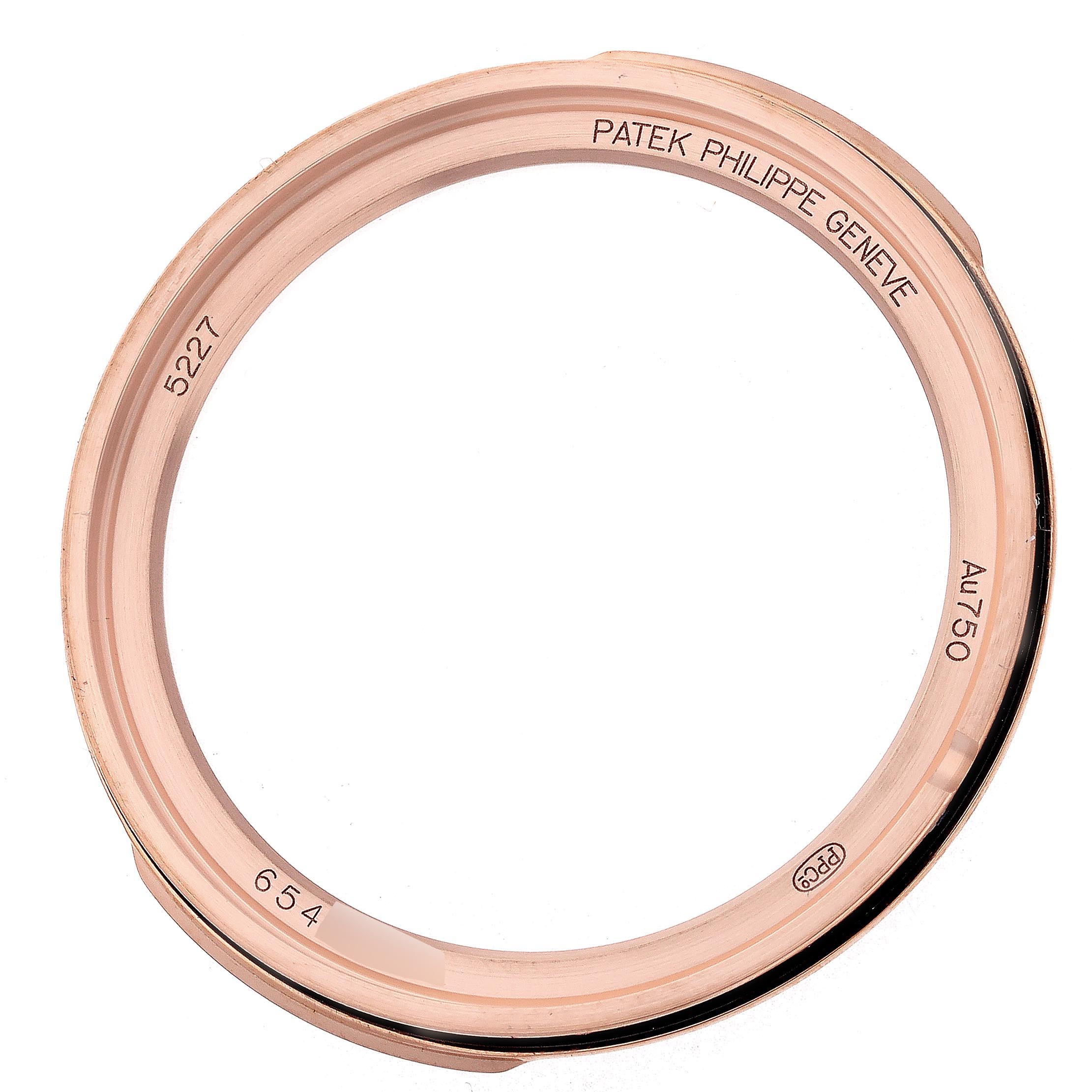 The image shows the rose gold bezel of a Patek Philippe Calatrava 5227R-001 Men's Rose Gold White Dial 5227R-001 Men's Rose Gold White Dial model, viewed from above.