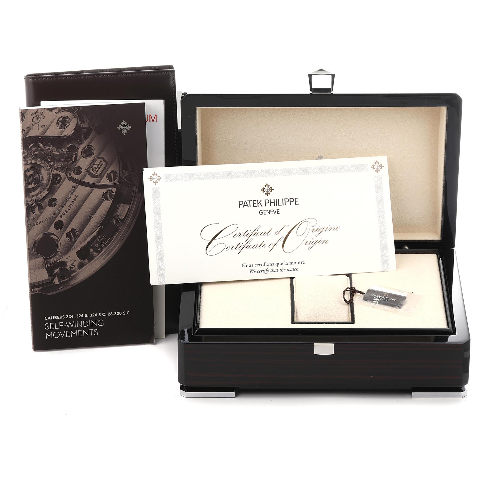 The image shows a Patek Philippe Calatrava 5227R-001 Men's Rose Gold White Dial 5227R-001 Men's Rose Gold White Dial box with the Certificate of Origin and a booklet, viewed from the front.