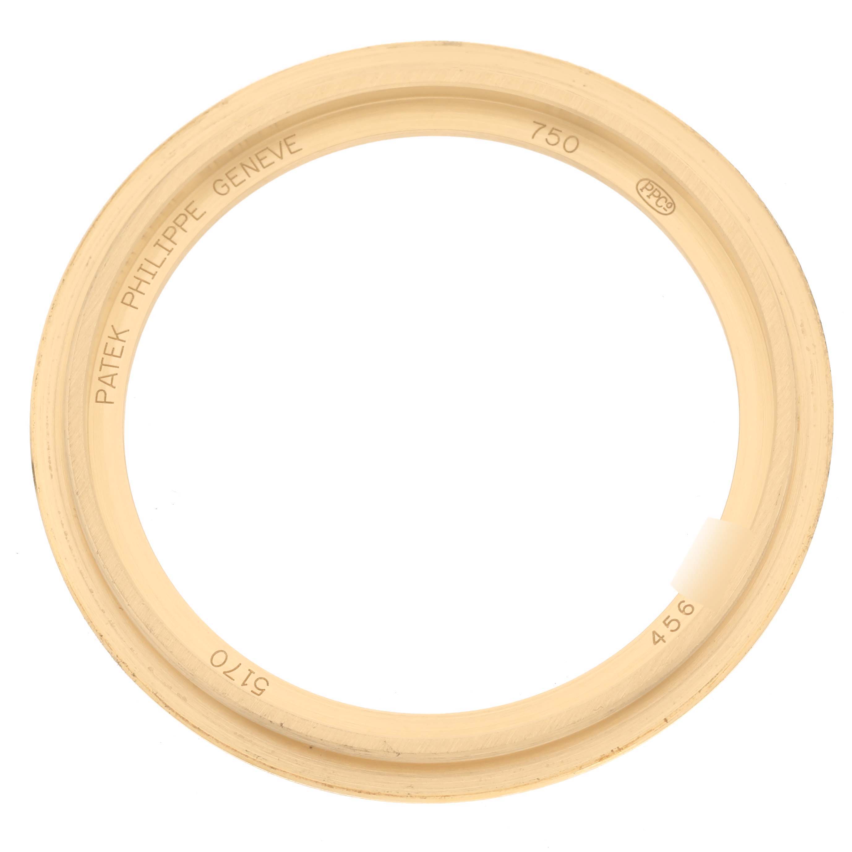 The image shows a gold bezel for the Patek Philippe Complications 5170J Men
s Yellow Gold Silver Dial 5170J Men
s Yellow Gold Silver Dial model, viewed from above.