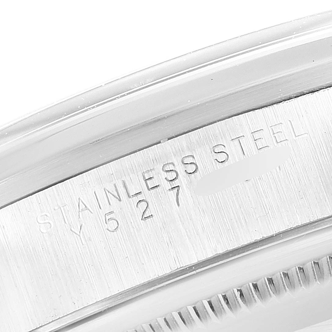 This close-up image shows the engraving on the stainless steel case of a Rolex Air-King 14000 Men's Stainless Steel Blue Dial 14000 Men's Stainless Steel Blue Dial watch.