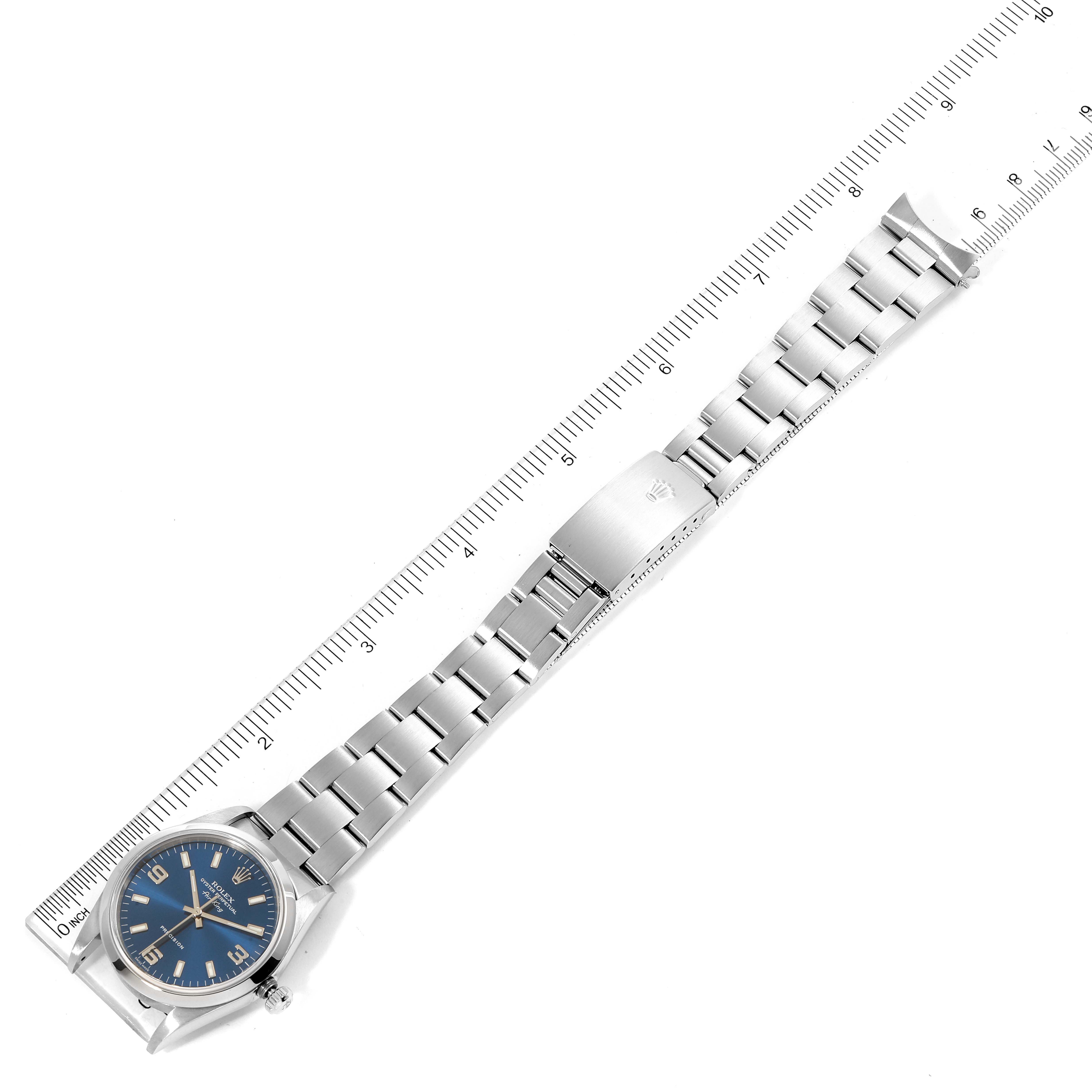 The image shows a top view of a Rolex Air-King 14000 Men's Stainless Steel Blue Dial 14000 Men's Stainless Steel Blue Dial, displaying the entire watch and its bracelet alongside a ruler for scale.