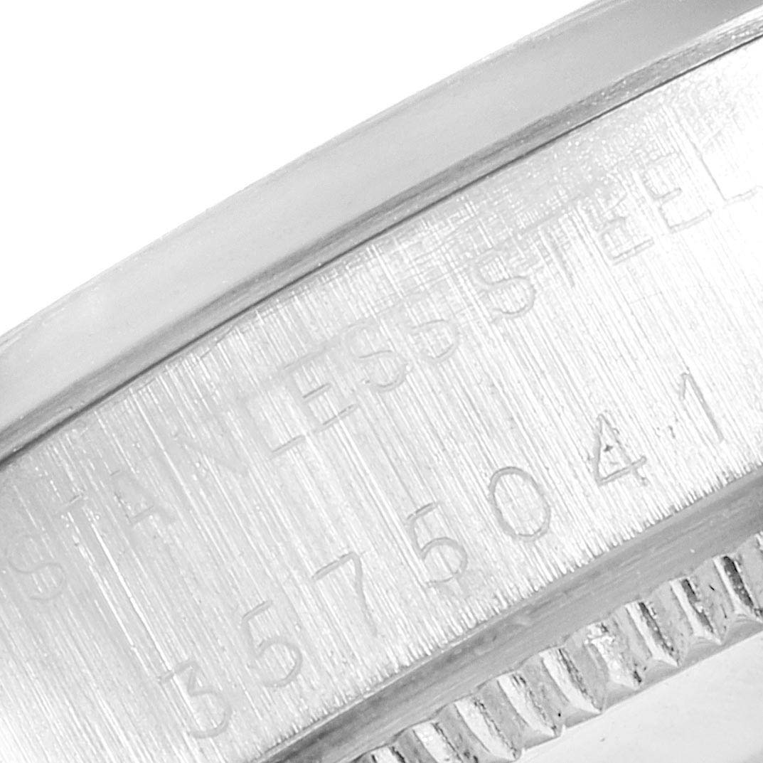 The image shows a close-up of the engraved serial number on the bezel of a Vintage Collection model by Rolex.