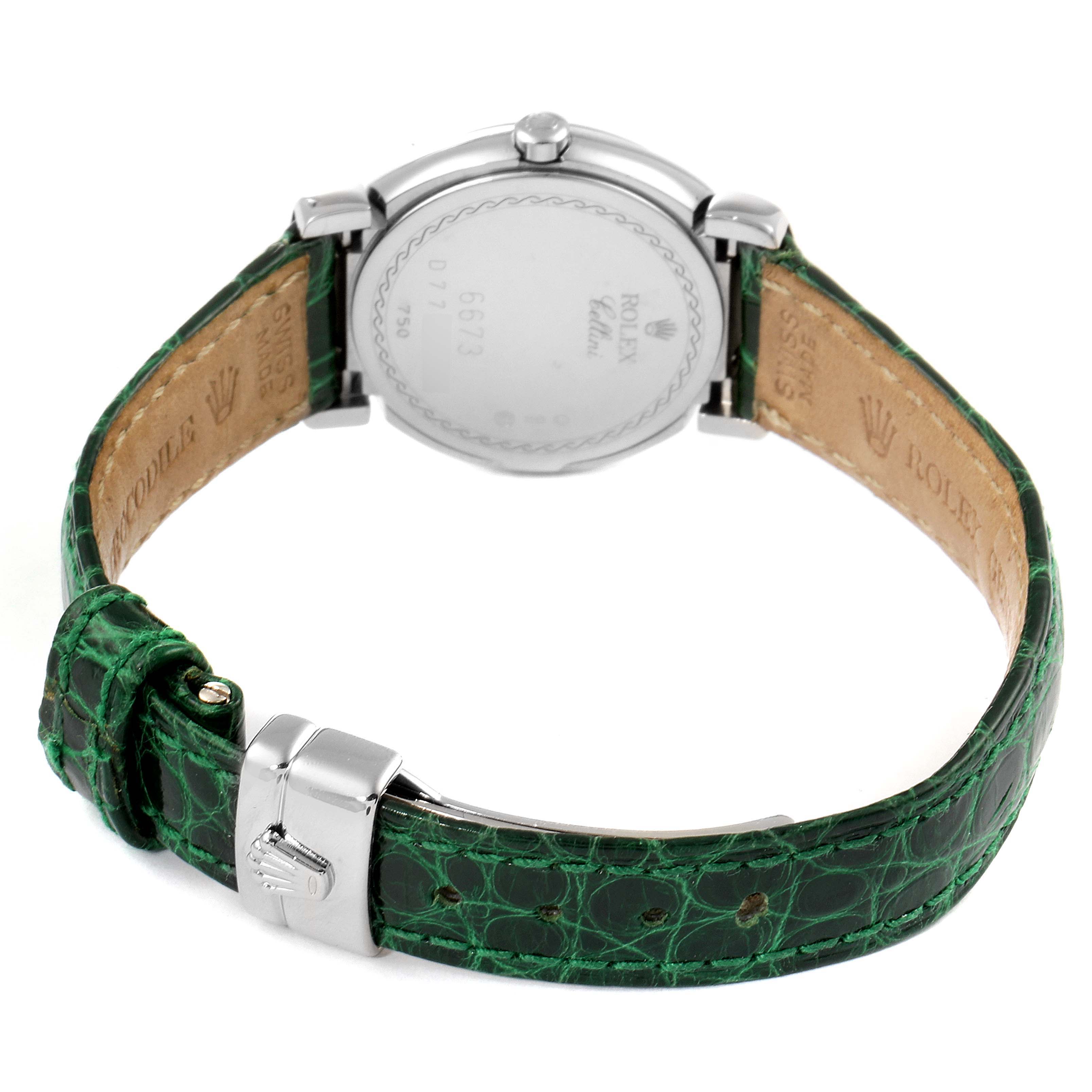This image shows the back of a Rolex Cellini 6673 Women's Stainless Steel Silver Dial 6673 Women's Stainless Steel Silver Dial watch with a green leather strap and clasp, viewed from the reverse side.