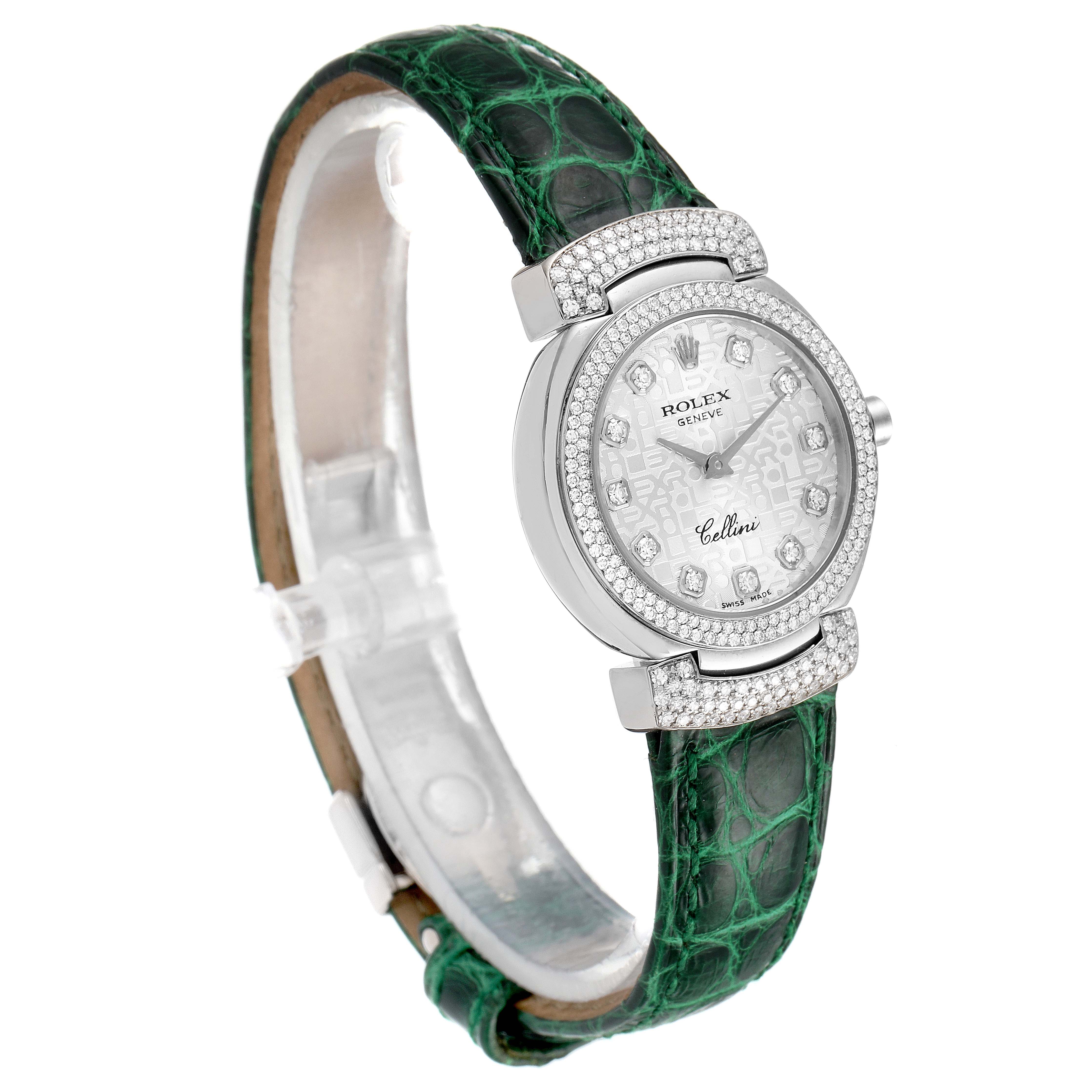 The Rolex Cellini 6673 Women's Stainless Steel Silver Dial 6673 Women's Stainless Steel Silver Dial watch is shown at a three-quarter angle, displaying its green strap, diamond-encrusted bezel, and dial.