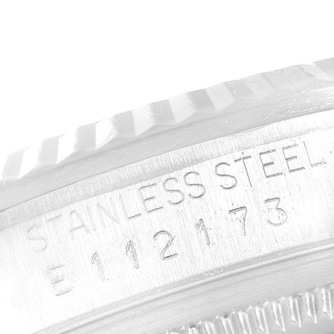The image shows a close-up of the engraving on the side of a stainless steel Rolex Datejust 16234 Men's Stainless Steel Silver Dial 16234 Men's Stainless Steel Silver Dial watch case.