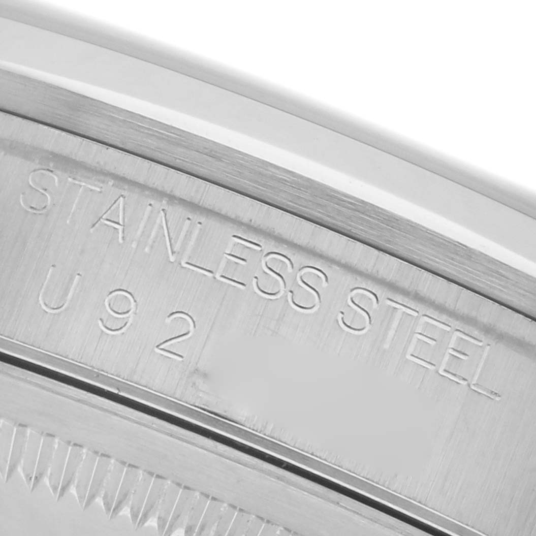 The image shows a close-up of the case side of a Rolex Datejust 16200 Men's Stainless Steel White Dial 16200 Men's Stainless Steel White Dial, highlighting the "STAINLESS STEEL" engraving.