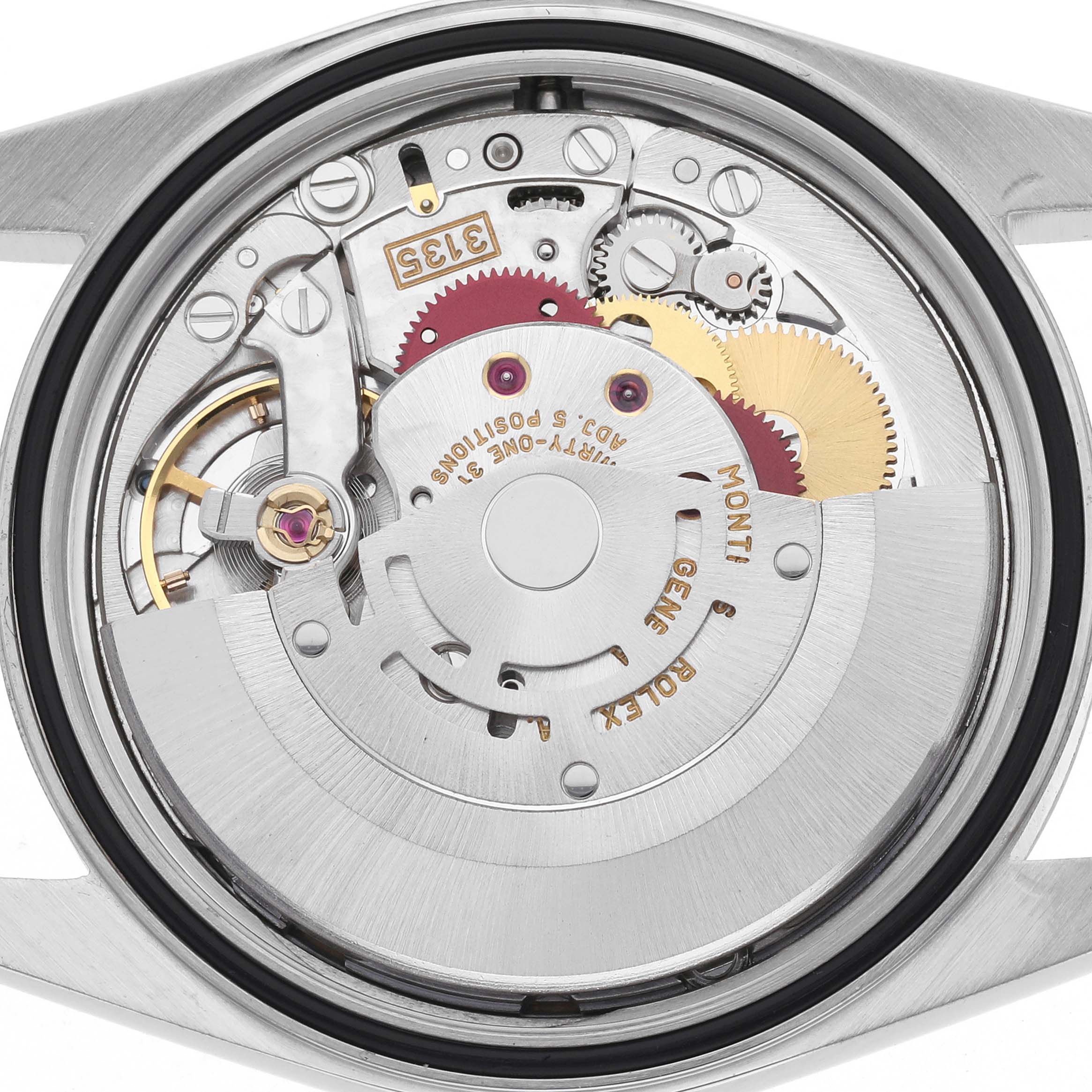 The image shows the movement of a Rolex Datejust 16200 Men's Stainless Steel White Dial 16200 Men's Stainless Steel White Dial, displaying gears and the rotor from a rear angle.