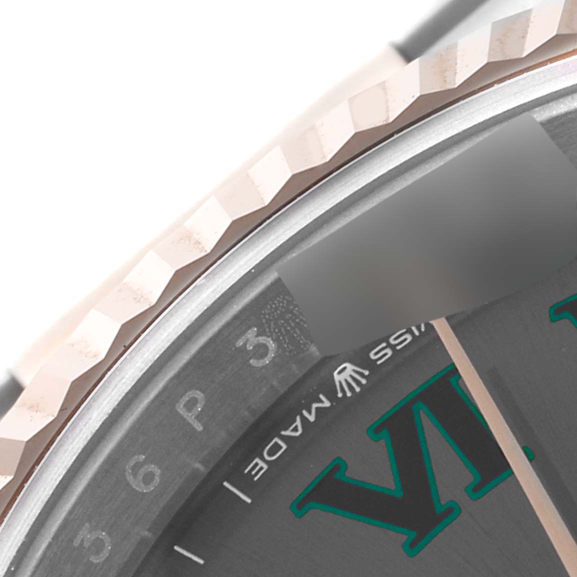 The image shows a close-up of the bezel and partial dial of a Rolex Datejust 126231 Men's Steel and Gold (two tone) Grey Dial 126231 Men's Steel and Gold (two tone) Grey Dial watch.
