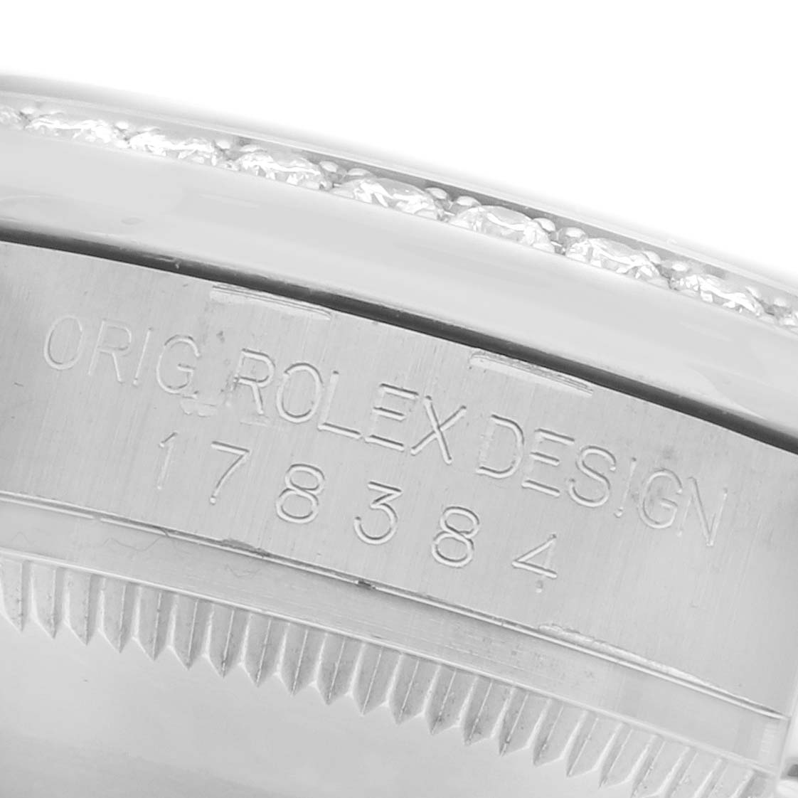 The image shows a close-up of the bezel, engraved with "ORIG. ROLEX DESIGN 178384," on a mid-size Rolex watch.