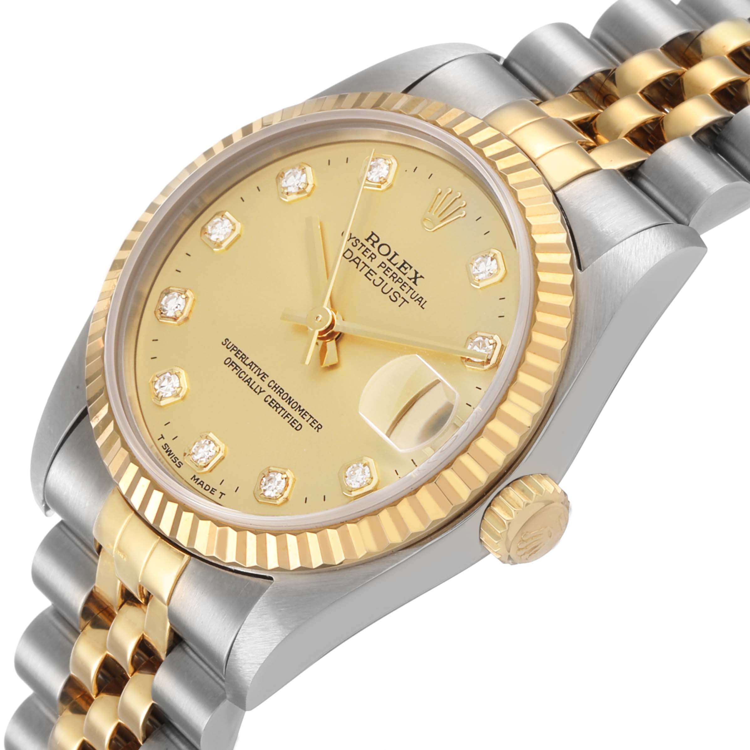 The Rolex Datejust 68273 Women's Stainless Steel Champagne Dial watch is shown at a tilted angle, highlighting its gold fluted bezel, diamond markers, and two-tone bracelet.