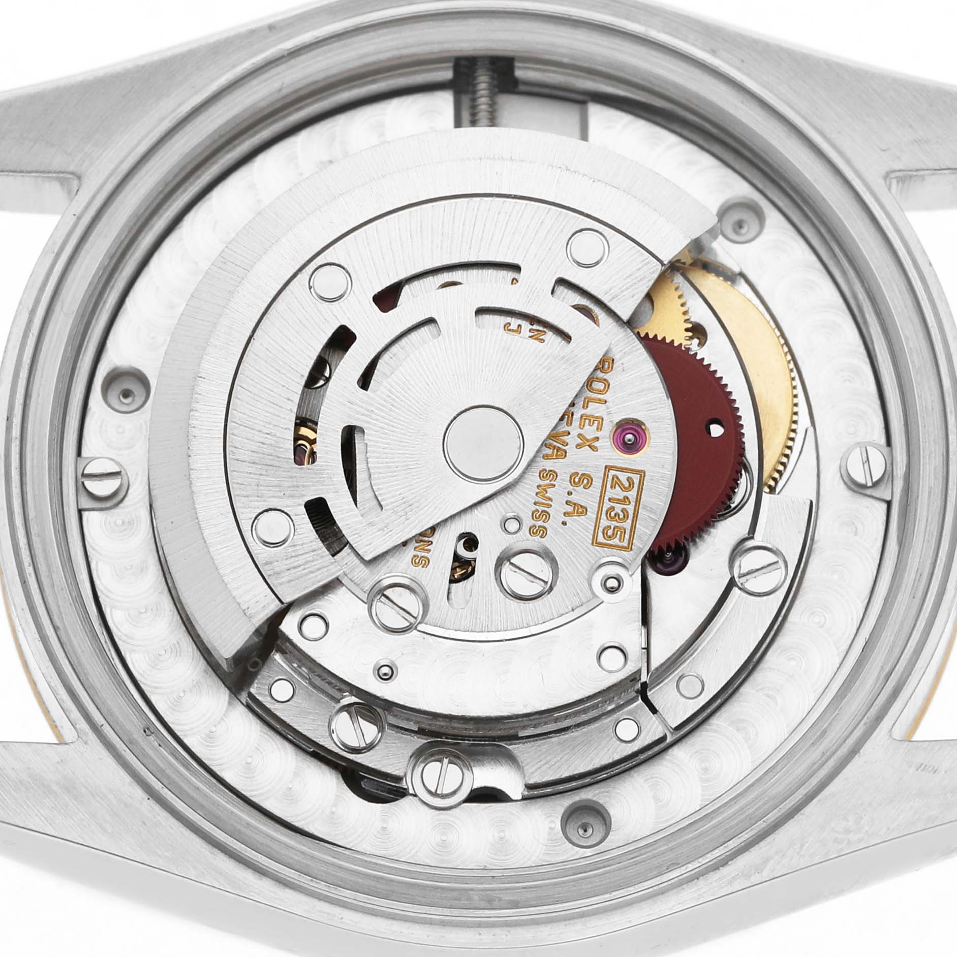 The image shows the movement of a Rolex Datejust 68273 Women's Stainless Steel Champagne Dial watch from a rear view, highlighting its intricate internal components.