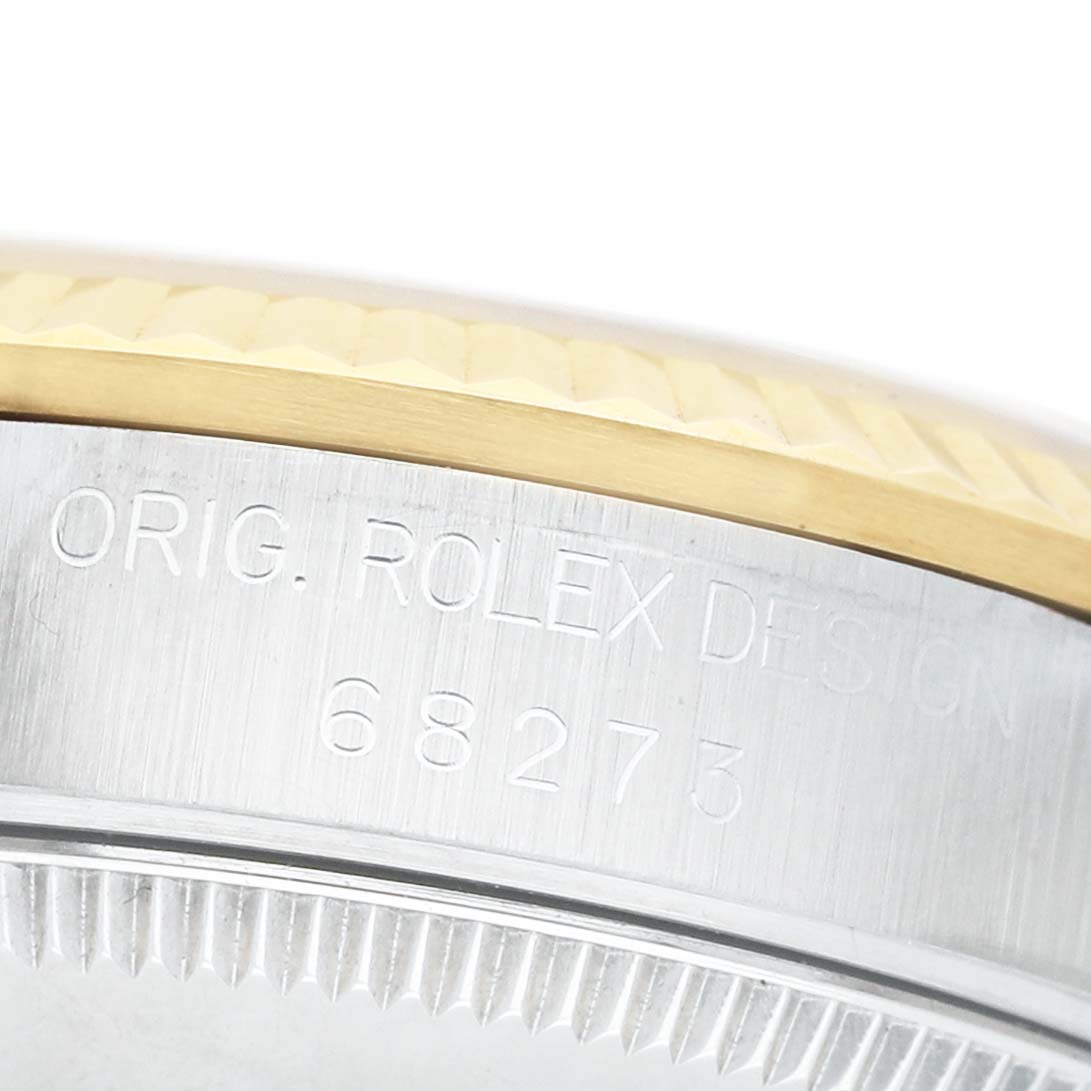 The image shows the side profile of a Rolex Datejust 68273 Women's Stainless Steel Champagne Dial watch, highlighting the bezel and engraved model number on the case.