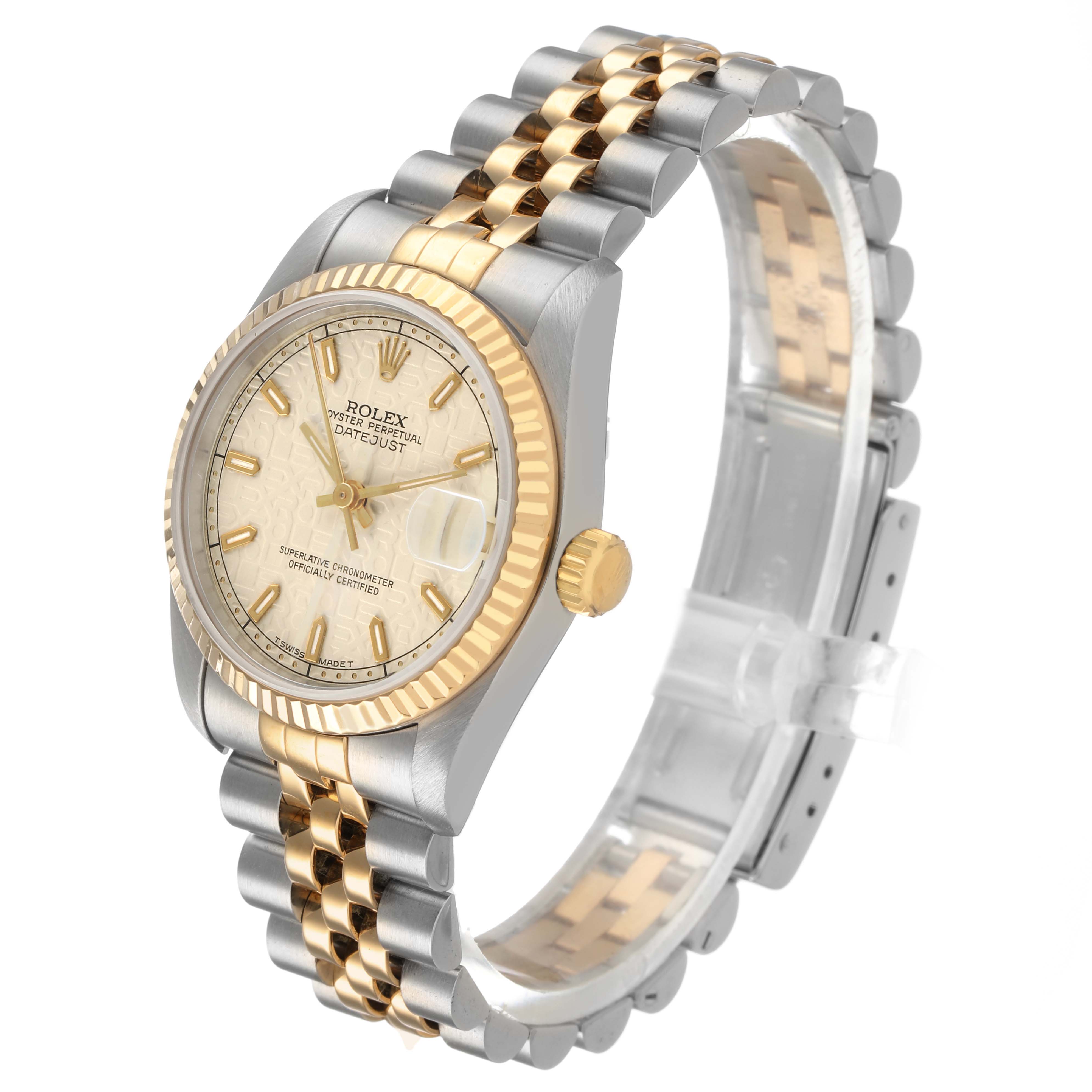 The Rolex Mid-Size 68273 Women's Steel and Gold (two tone) Beige Dial model is shown from a three-quarter angle, featuring its dial, bezel, crown, and bracelet.