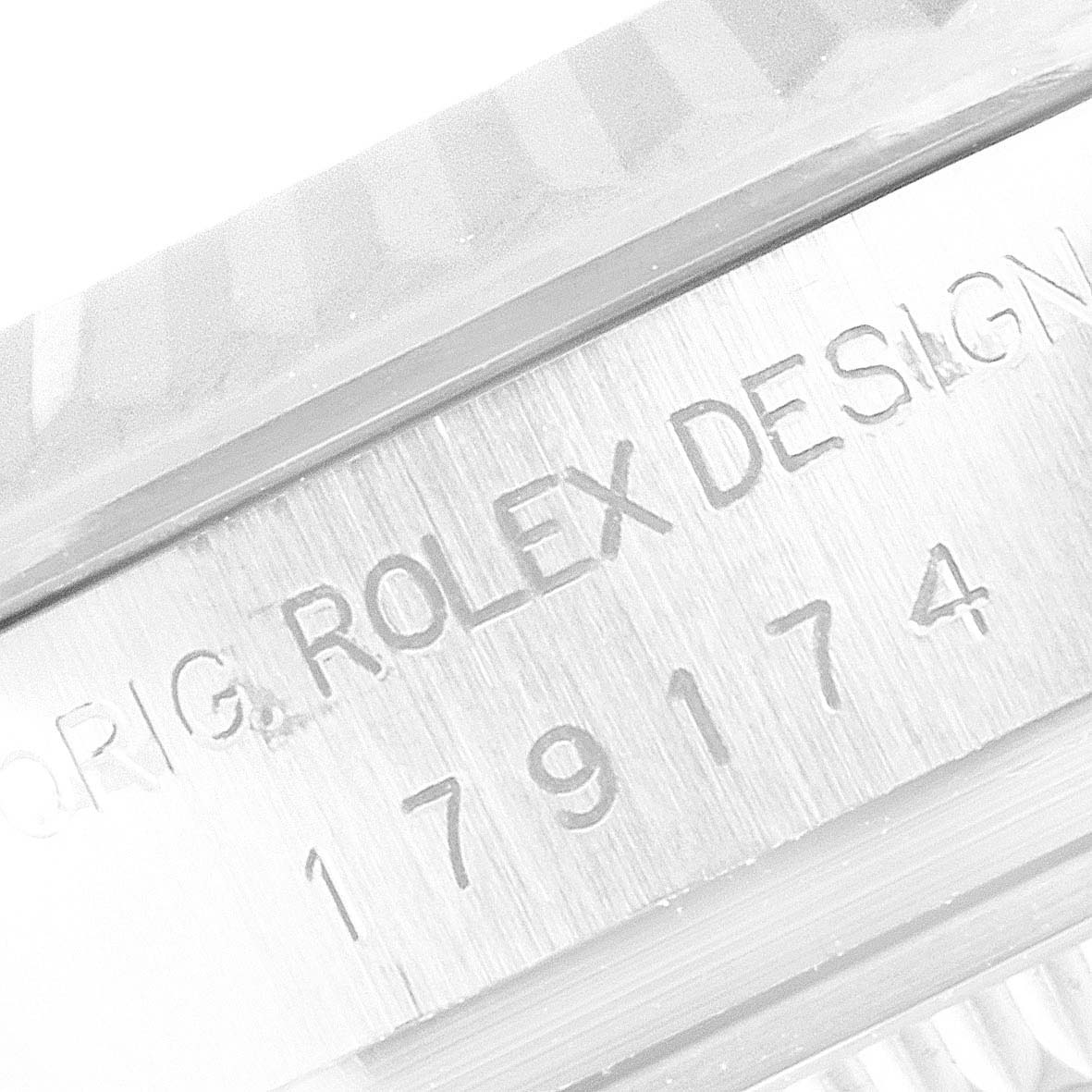 This close-up image showcases the serial number and "Rolex Design" inscription on the side of a Rolex Datejust 179174 Women's Stainless Steel Mother of Pearl Dial 179174 Women's Stainless Steel Mother of Pearl Dial watch.