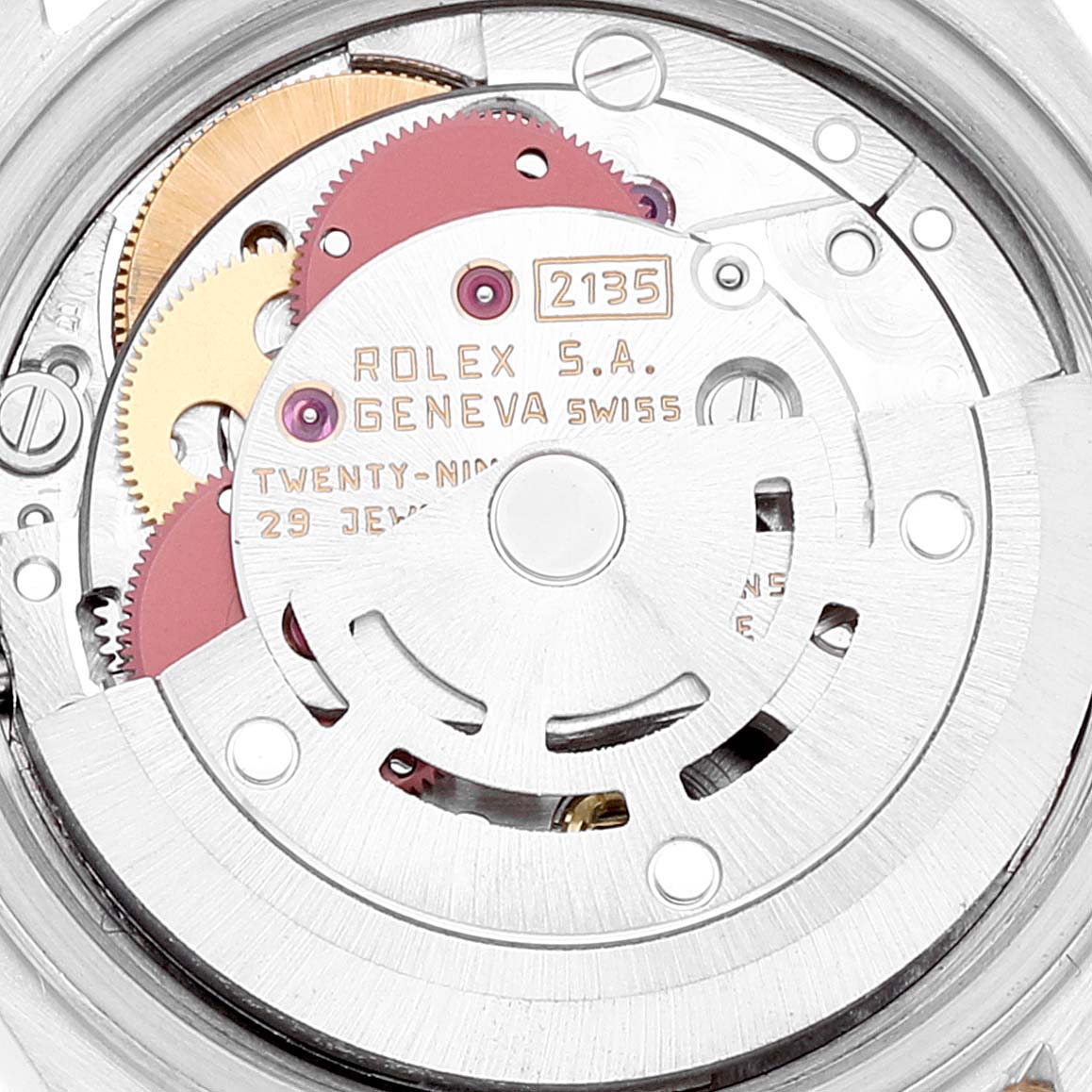 The image shows a close-up view of the Rolex Datejust 69173 Women's Steel and Gold (two tone) Champagne Dial's movement, highlighting the gears and rotor.