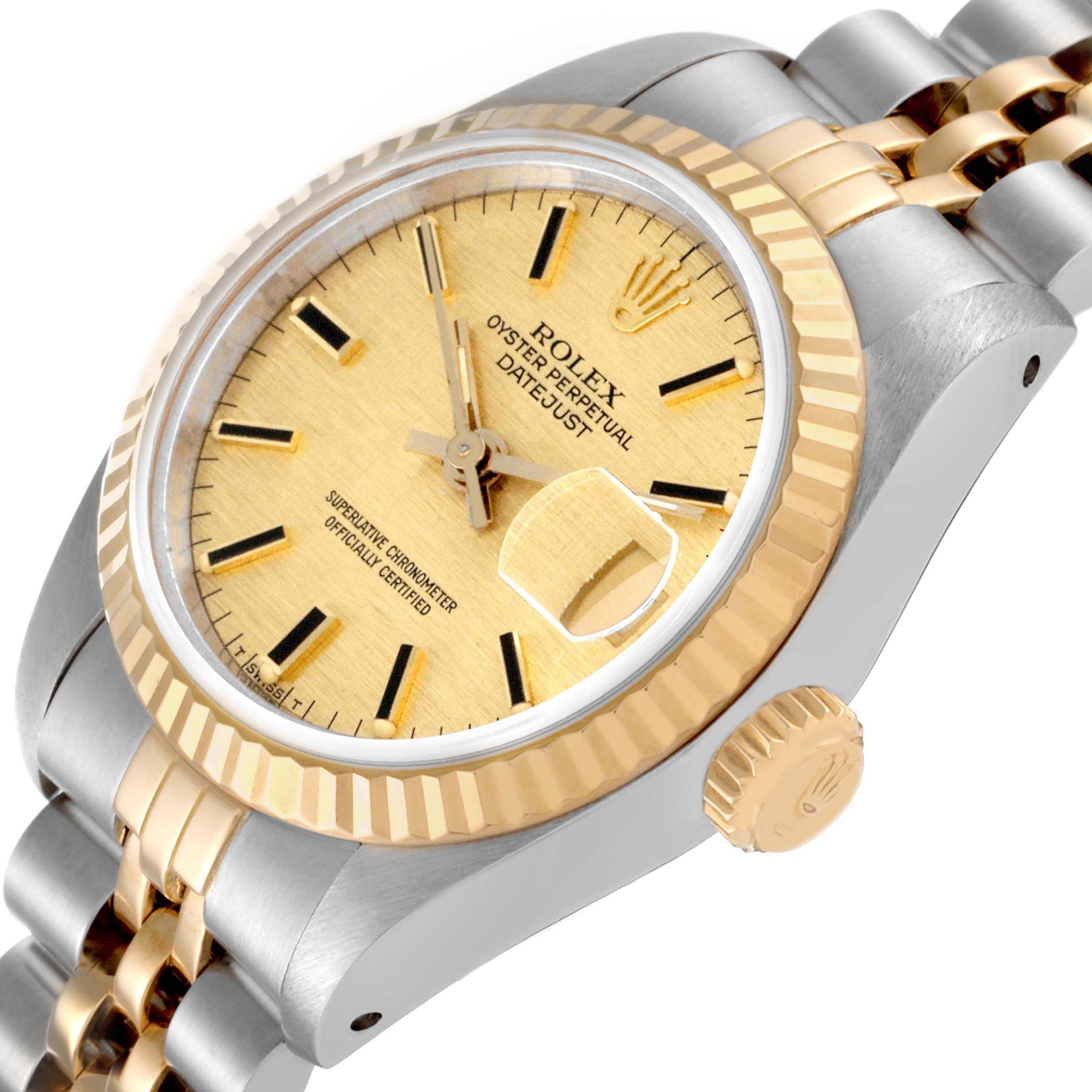 The Rolex Datejust 69173 Women's Steel and Gold (two tone) Champagne Dial watch is shown at an angle highlighting the gold bezel, dial, crown, and jubilee bracelet.