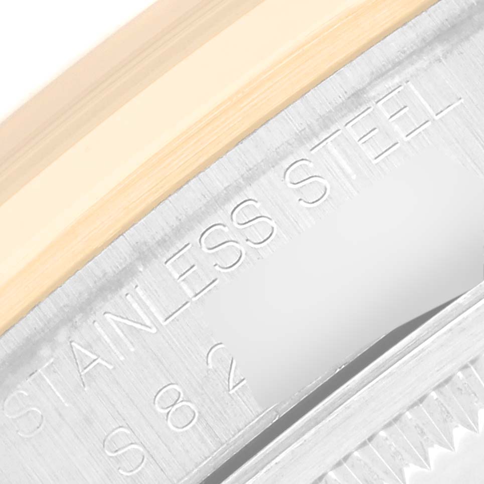 This close-up image shows the inscription on the stainless steel case of the Rolex Datejust 16203 Men's Steel and Gold (two tone) Grey Dial 16203 Men's Steel and Gold (two tone) Grey Dial watch.