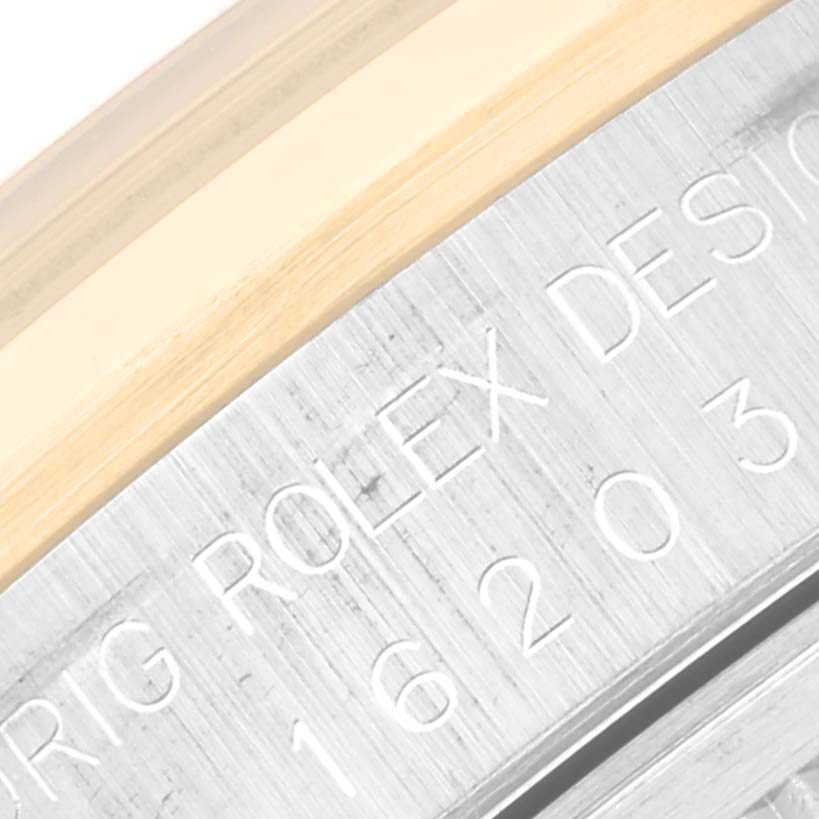 This close-up image shows the engraved side of the case back of a Rolex Datejust 16203 Men's Steel and Gold (two tone) Grey Dial 16203 Men's Steel and Gold (two tone) Grey Dial watch.