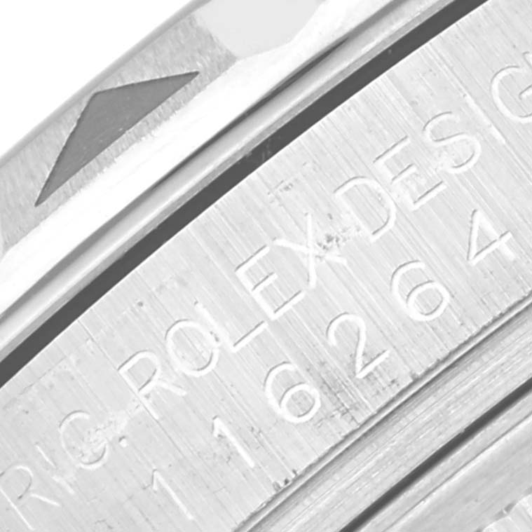 The image shows a close-up of the engraved text and bezel of a Rolex Turn-o-Graph 116264 Men's Stainless Steel Black Dial 116264 Men's Stainless Steel Black Dial watch.