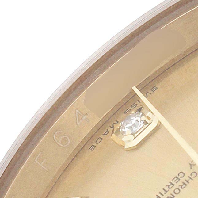 The image shows a close-up of the Rolex Datejust 116208 Men's Yellow Gold Champagne Dial dial edge with a diamond hour marker and "Swiss Made" text.