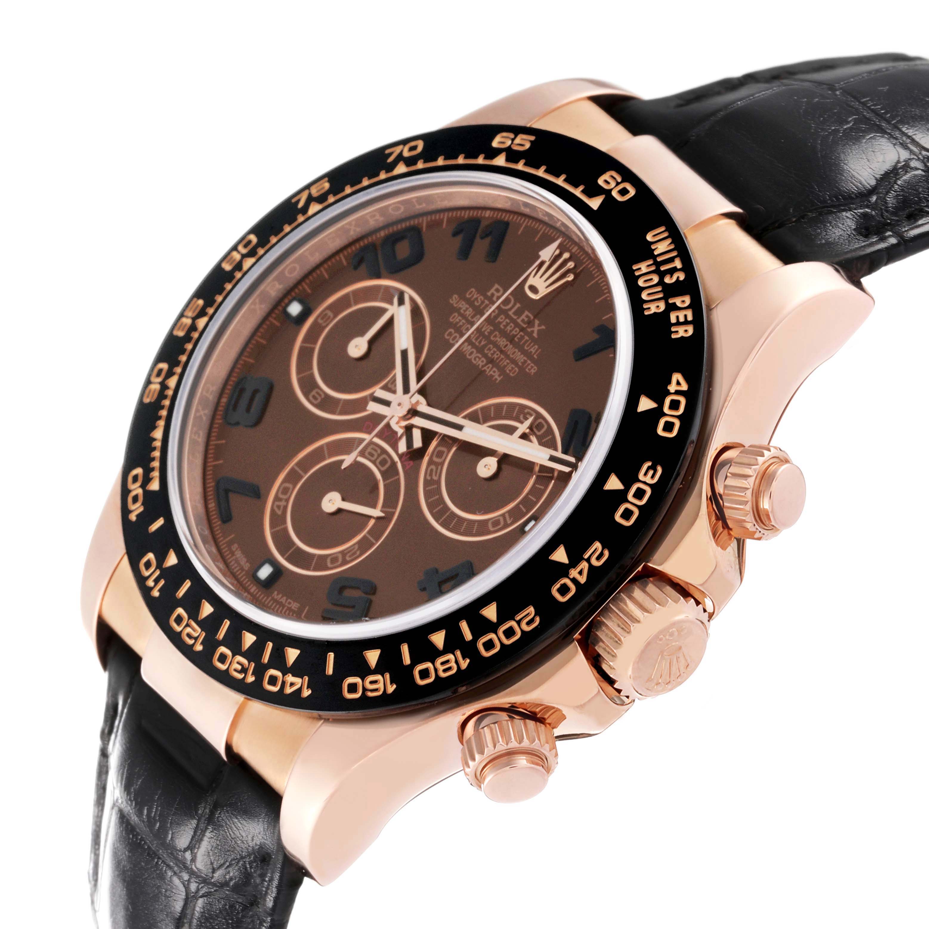 The Rolex Daytona 116515 Men's Rose Gold Brown Dial is shown at an angle highlighting the dial, bezel, crown, pushers, and leather strap.