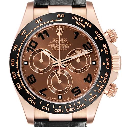 The Rolex Daytona 116515 Men's Rose Gold Brown Dial watch is shown at a front angle, highlighting its brown dial, black ceramic bezel, and chronograph sub-dials.