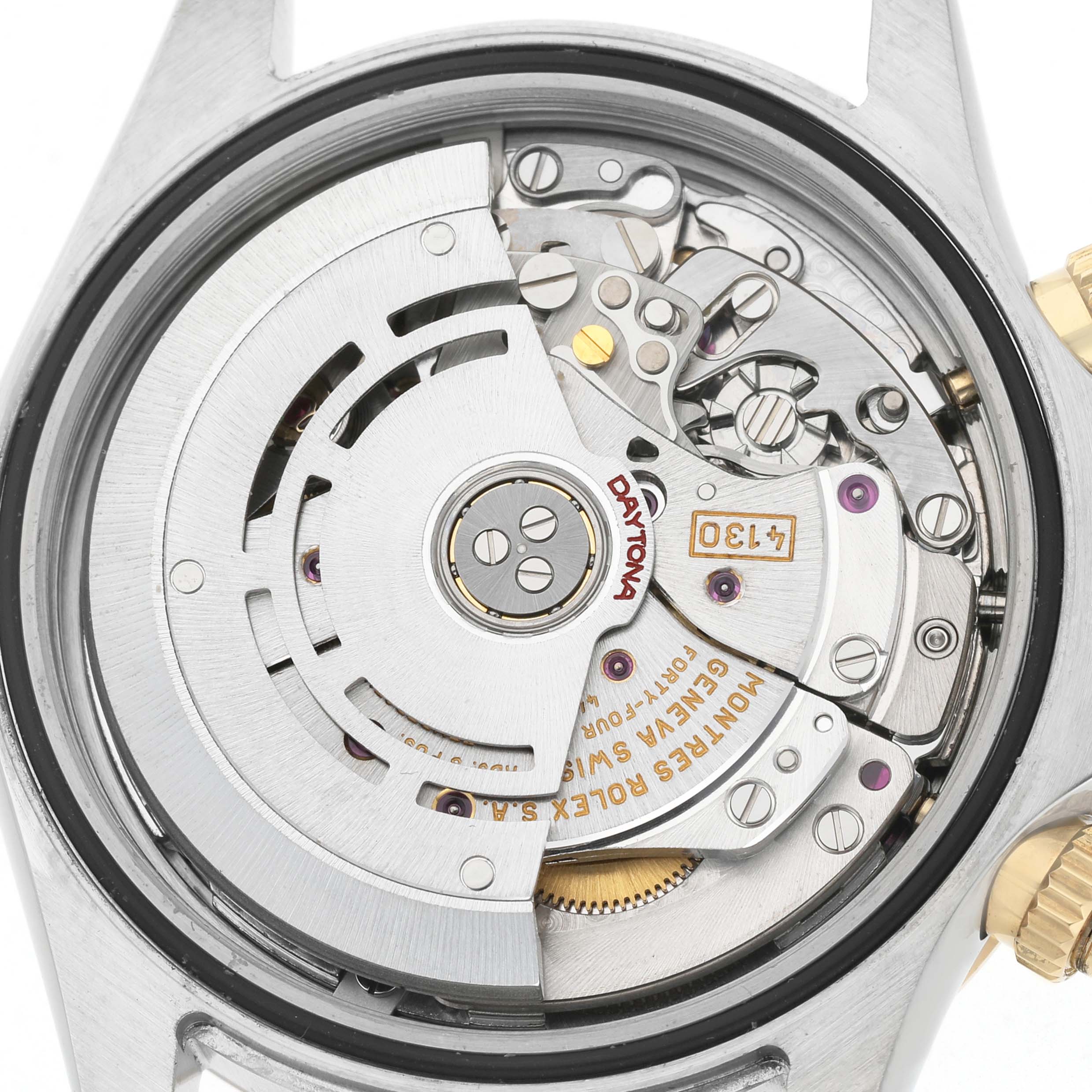 The image shows the movement from the back of a Rolex Daytona 116523 Men's Steel and Gold (two tone) Black Dial, highlighting the intricate mechanics and rotor.
