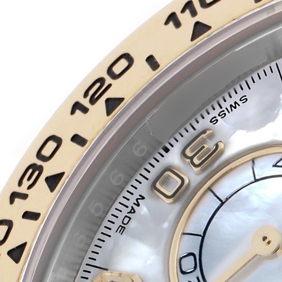 The image shows a close-up of the Rolex Daytona 116503 Men's Steel and Gold (two tone) Mother of Pearl Dial 116503 Men's Steel and Gold (two tone) Mother of Pearl Dial's bezel and part of the dial, highlighting the tachymeter scale and markers.