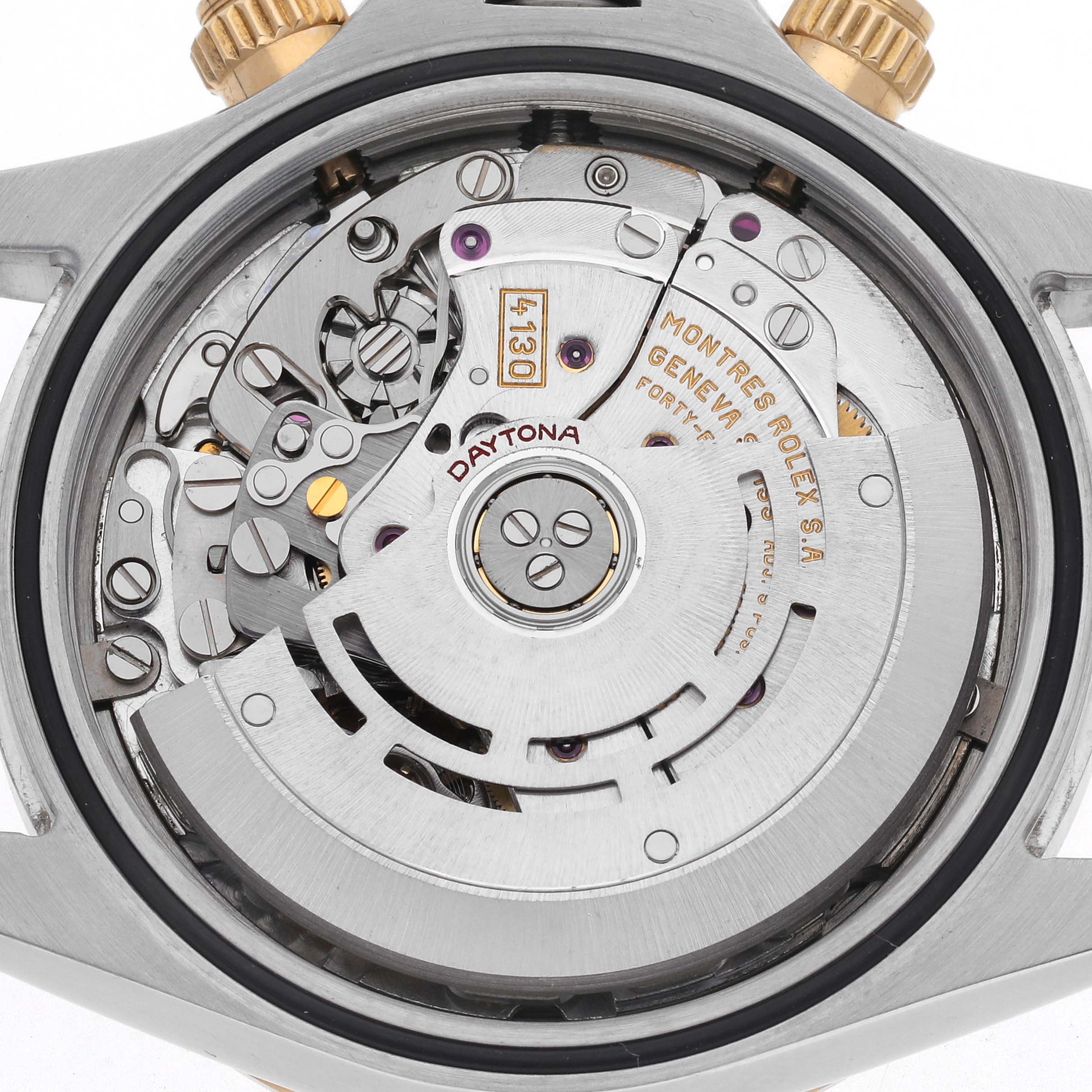 The image shows the movement of a Rolex Daytona 116523 Men's Steel and Gold (two tone) White Dial 116523 Men's Steel and Gold (two tone) White Dial watch from a top-down angle, revealing intricate internal mechanisms.