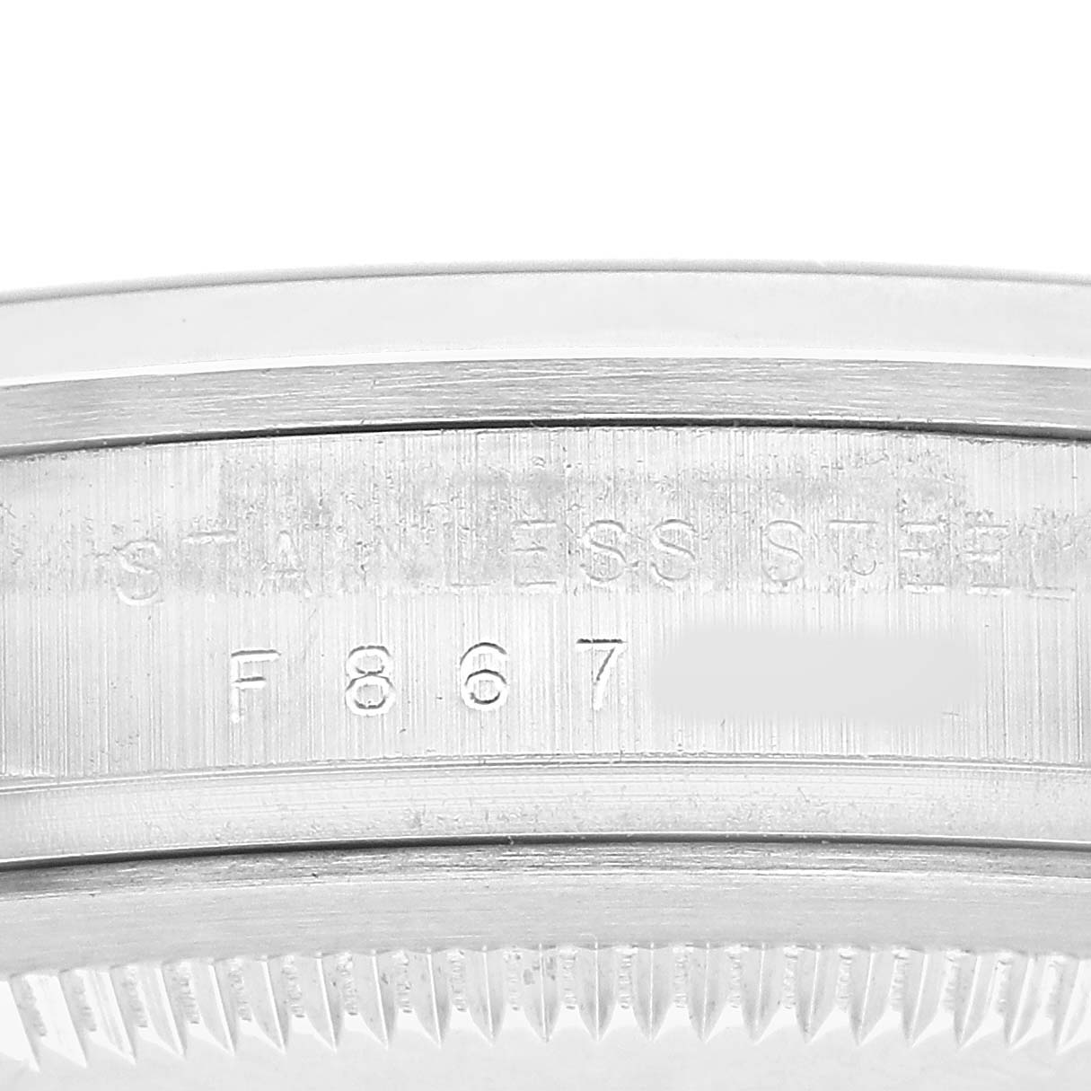 The image shows a close-up of the serial number engraving on the side of the Rolex Explorer 114270 Men's Stainless Steel Black Dial's case.