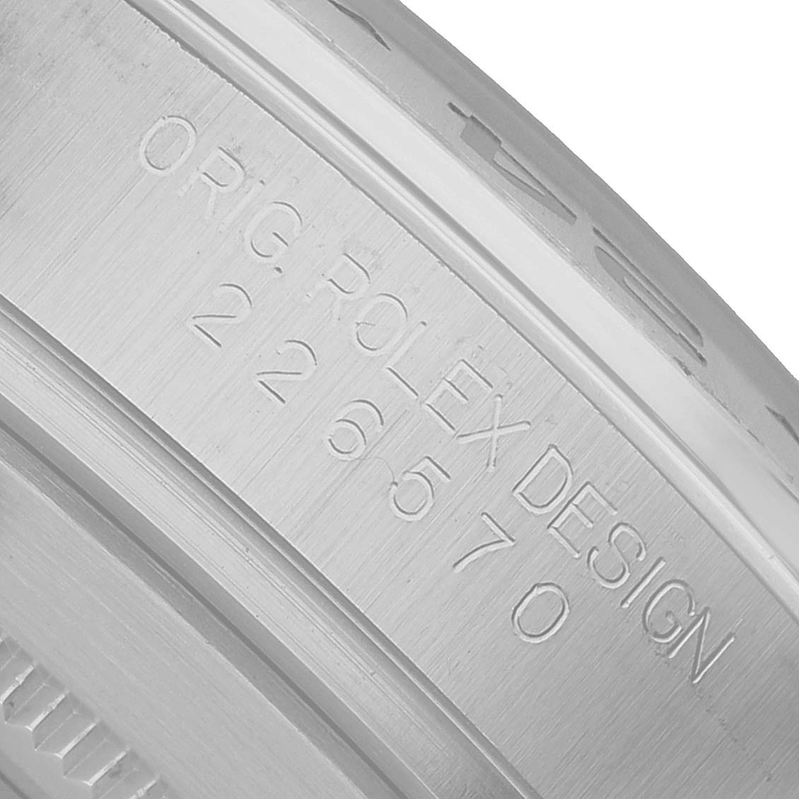 This image shows a close-up of the engraving on the bezel or inner rim of a Rolex Explorer 226570 Men's Stainless Steel Black Dial watch model.