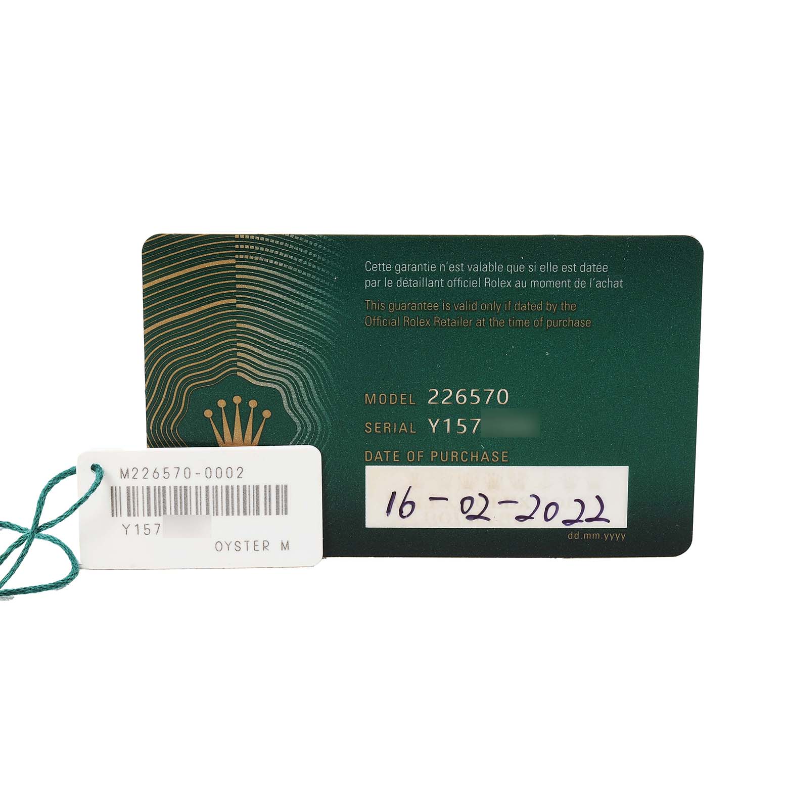 The image shows a Rolex Explorer 226570 Men's Stainless Steel Black Dial model 226570 warranty card with a tag, displaying the serial number and purchase date.