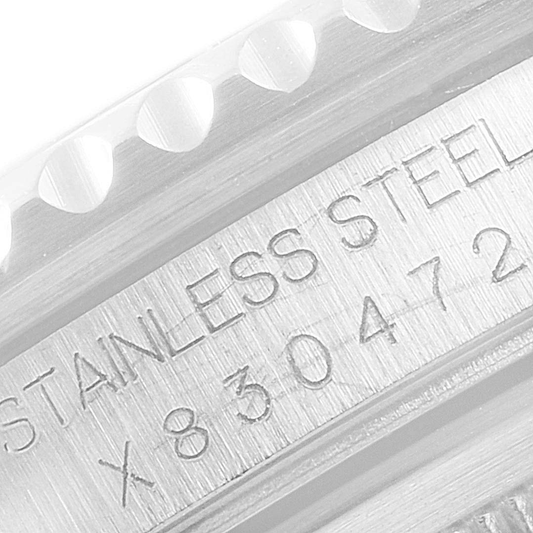 This is a close-up image of the stainless steel case and engraving of a Rolex GMT-Master 16700 Men's Stainless Steel Black Dial 16700 Men's Stainless Steel Black Dial watch.