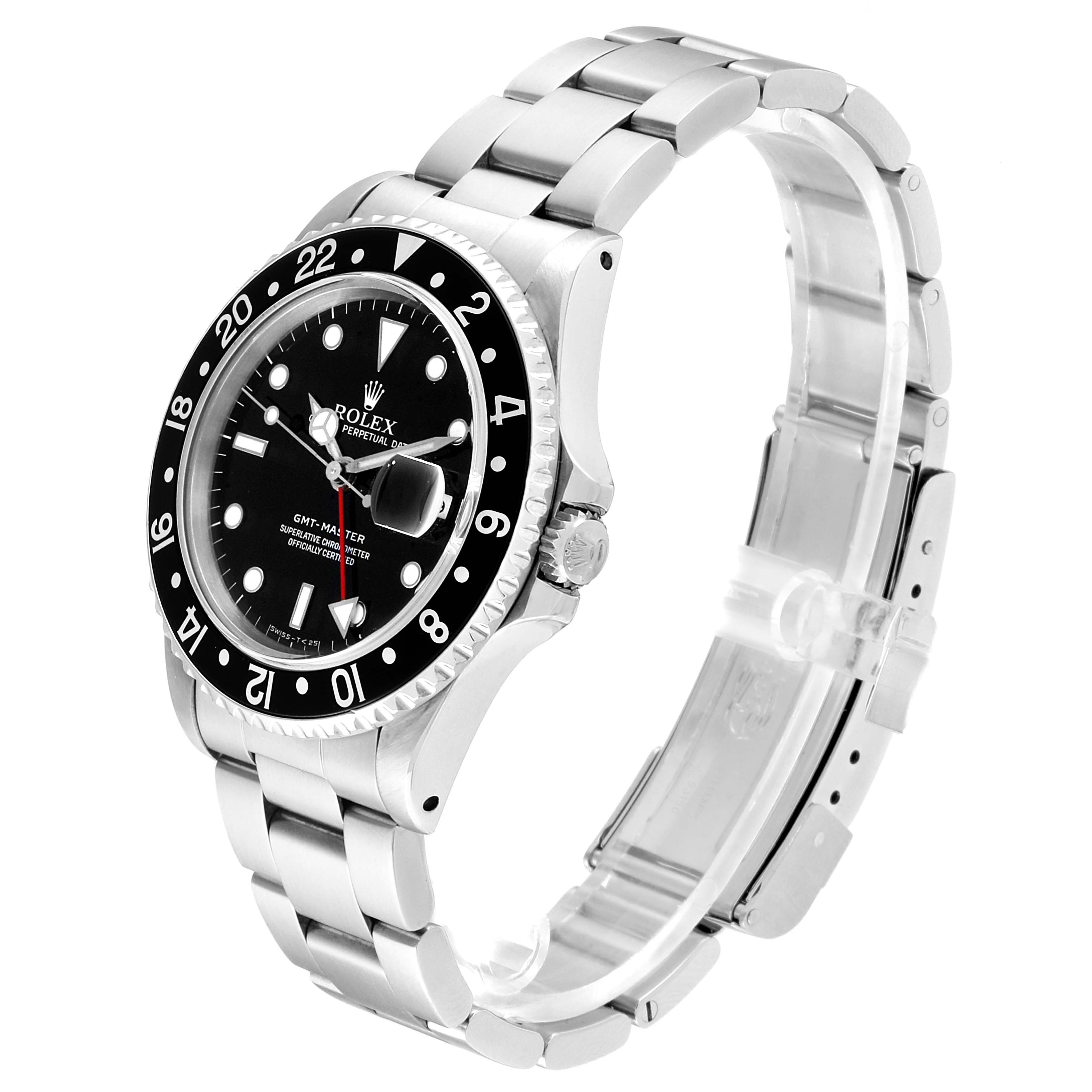 The image shows a Rolex GMT-Master 16700 Men's Stainless Steel Black Dial 16700 Men's Stainless Steel Black Dial watch angled to display the face, bezel, crown, and part of the bracelet.
