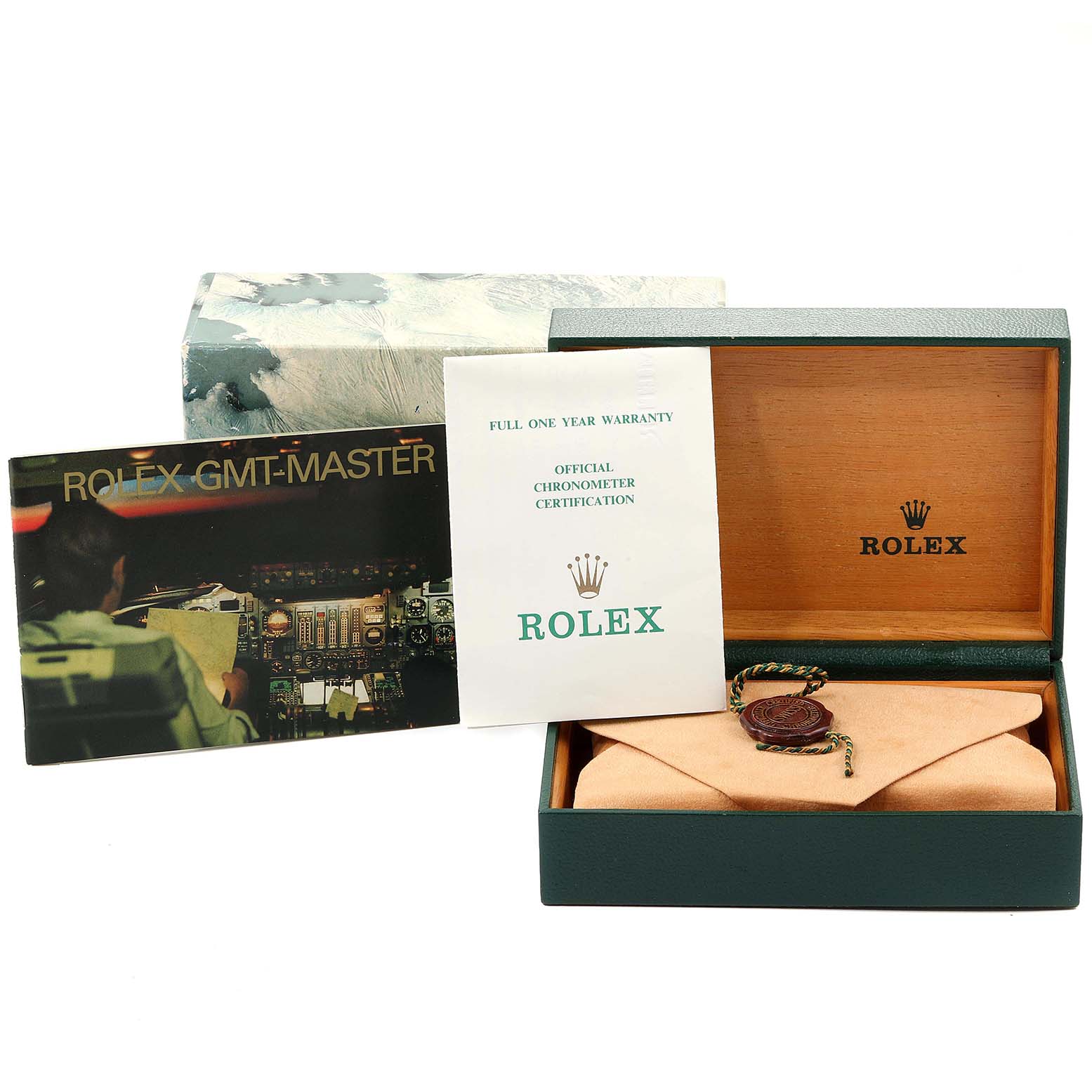 The image shows an open Rolex GMT-Master 16700 Men's Stainless Steel Black Dial 16700 Men's Stainless Steel Black Dial presentation box with warranty booklet and certification.