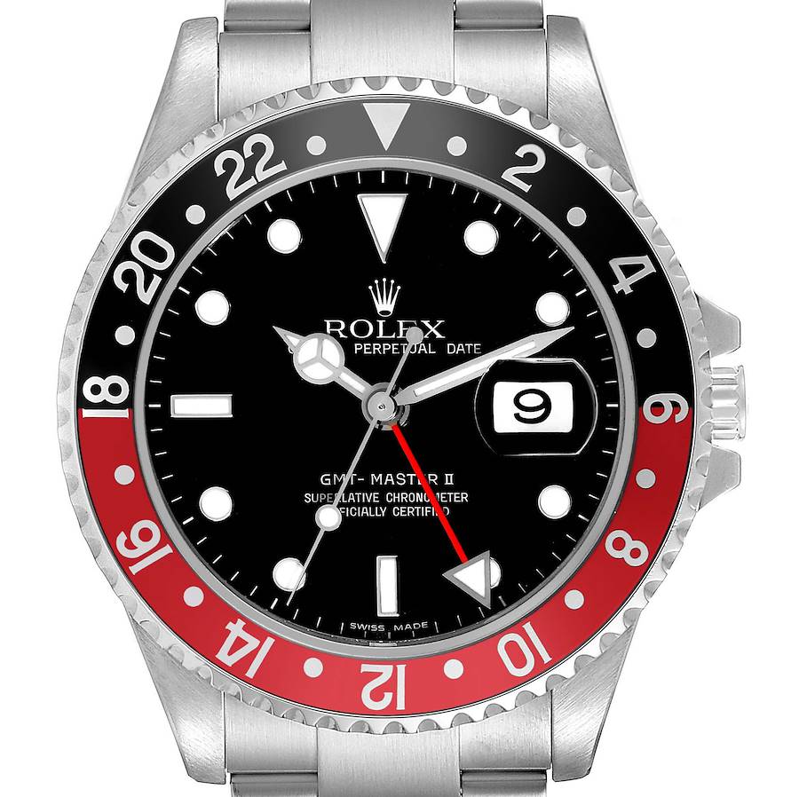 The Rolex GMT-Master watch is shown from a top-down angle, displaying the bezel, dial, hands, and date window.