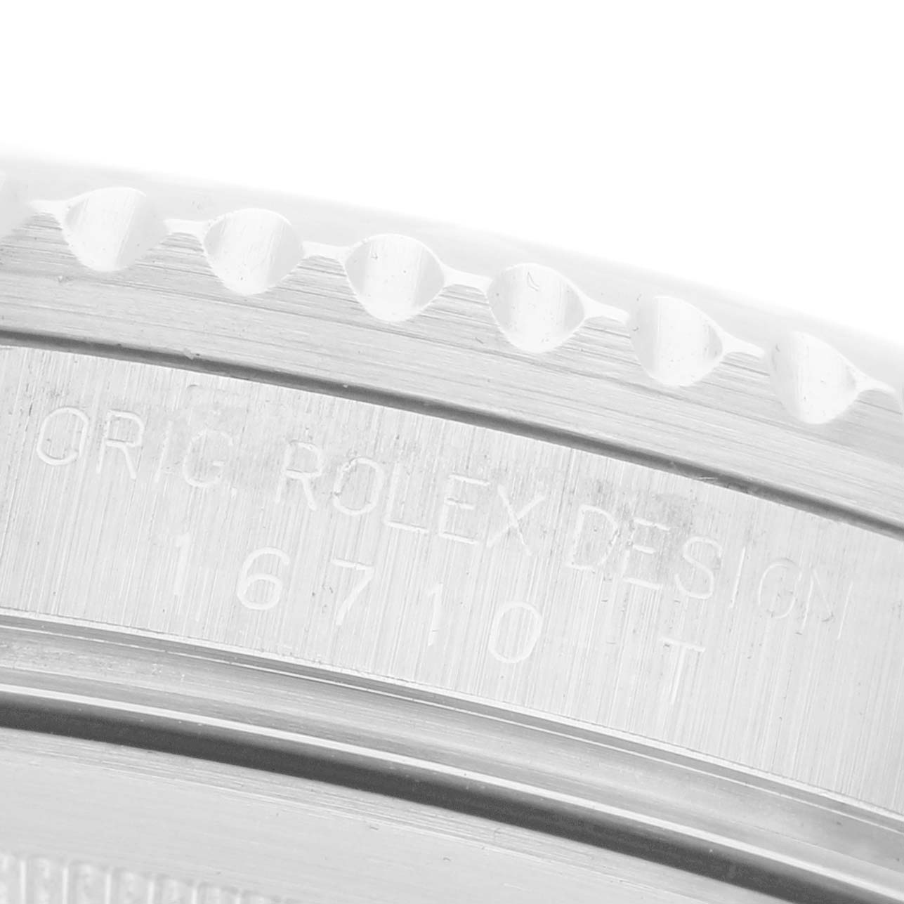 The image shows a close-up of the engraved case side of a Rolex GMT-Master 16710 Men's Stainless Steel Black Dial, highlighting the model number.