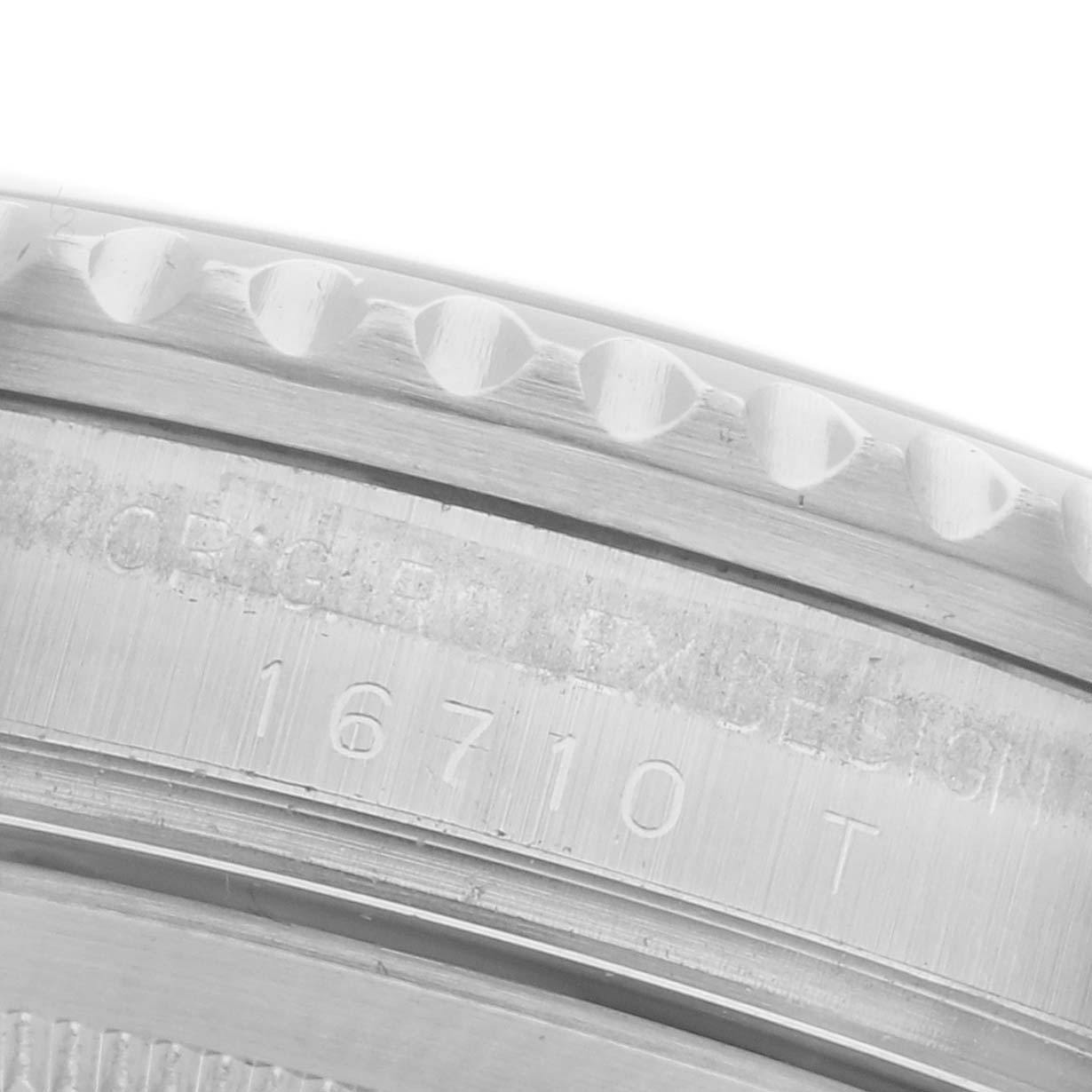 The image shows a close-up angle of the case side of a Rolex GMT-Master 16710 Men's Stainless Steel Black Dial 16710 Men's Stainless Steel Black Dial with model number engravings.