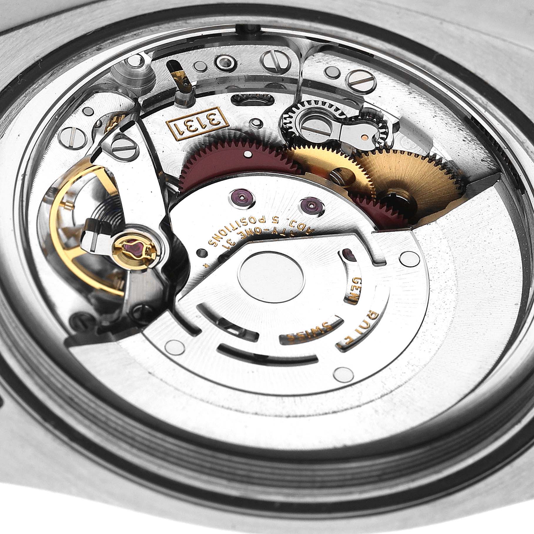 The image shows the internal movement parts of a Rolex Milgauss 116400 Men's Stainless Steel Blue Dial watch from a top-down angle.