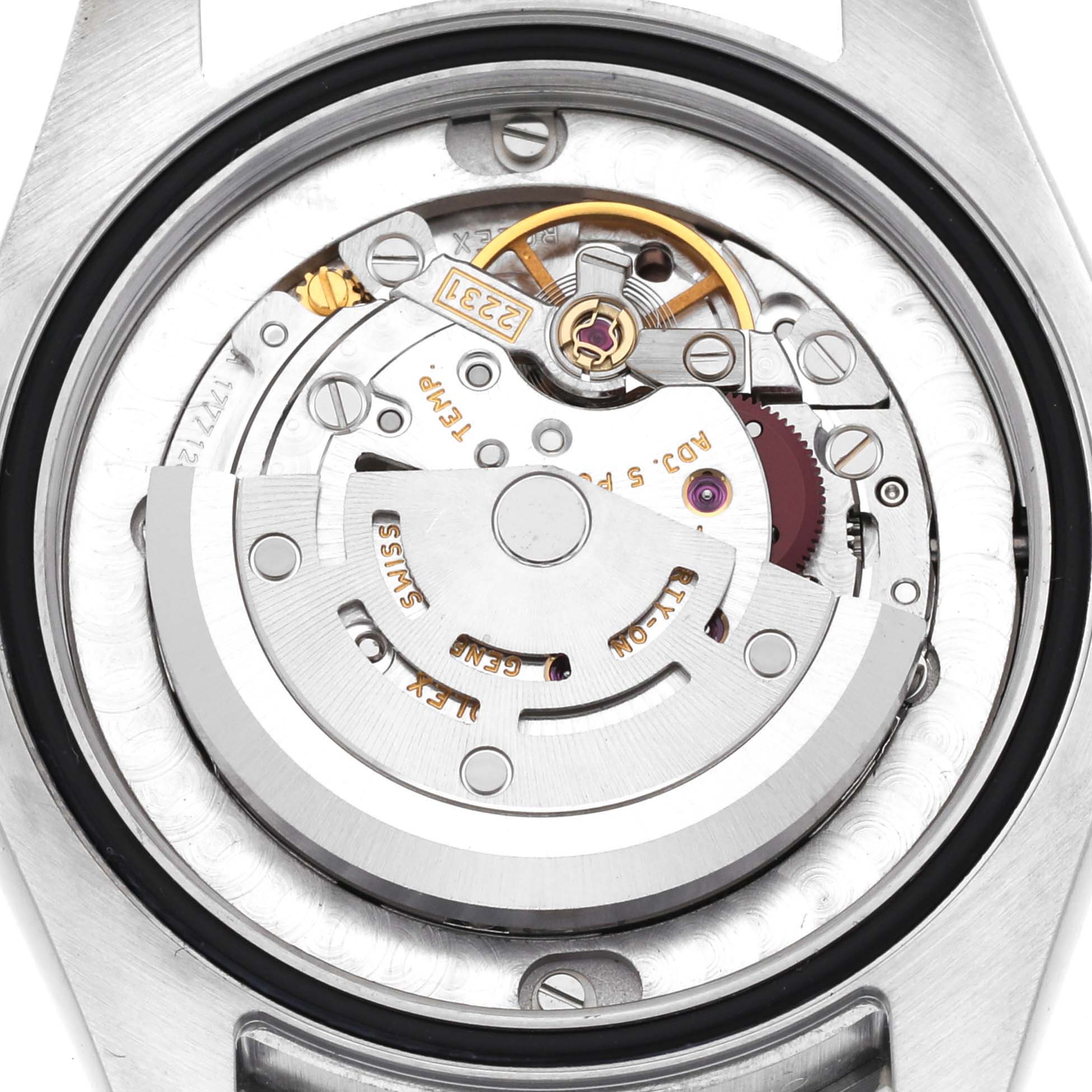 The image shows the inner mechanical movement of a mid-size Rolex watch from a close-up, back view angle.