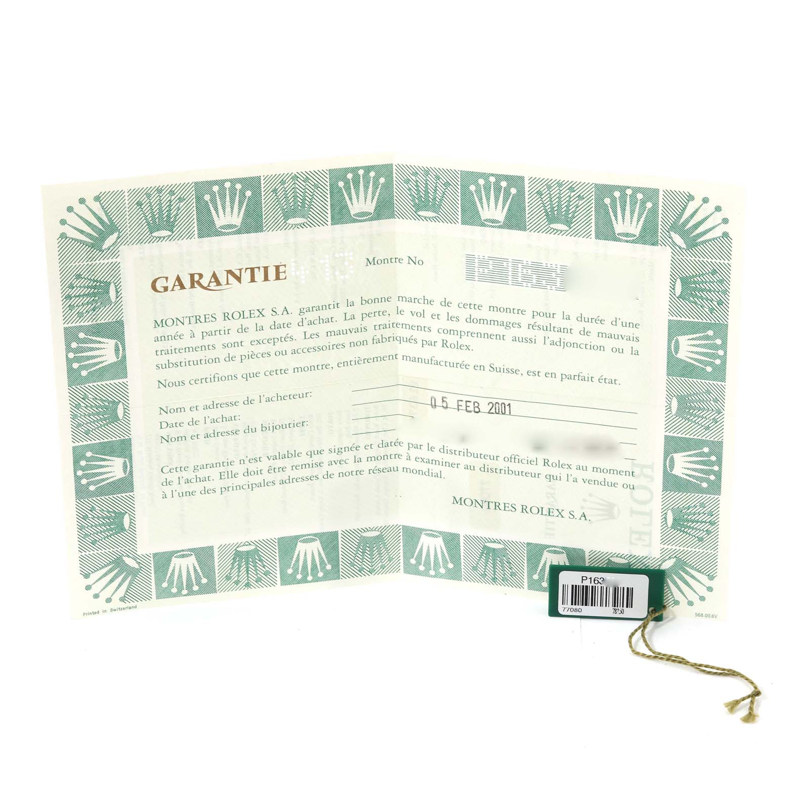 The image shows the warranty certificate and a green Rolex hang tag for a Mid-Size Rolex watch.