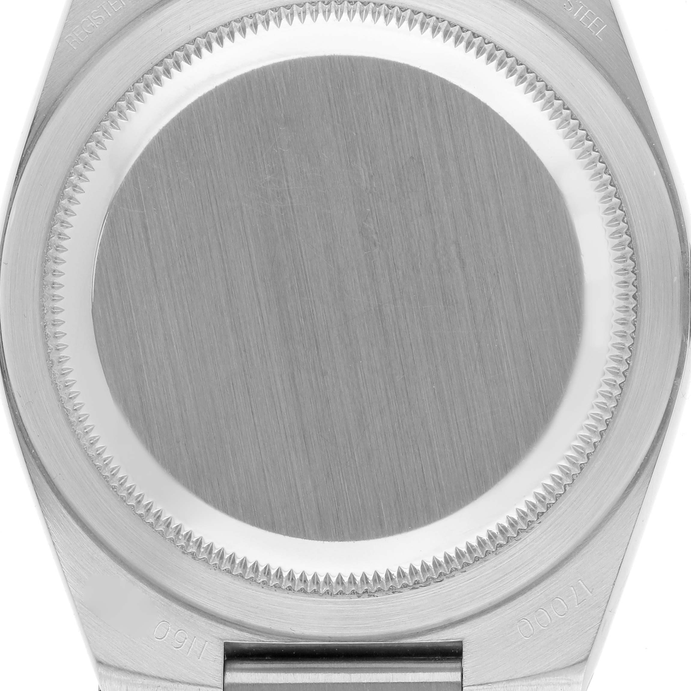 The image shows the back case of a Rolex Oysterquartz 17000 Men's Stainless Steel White Dial 17000 Men's Stainless Steel White Dial watch from a top-down angle.