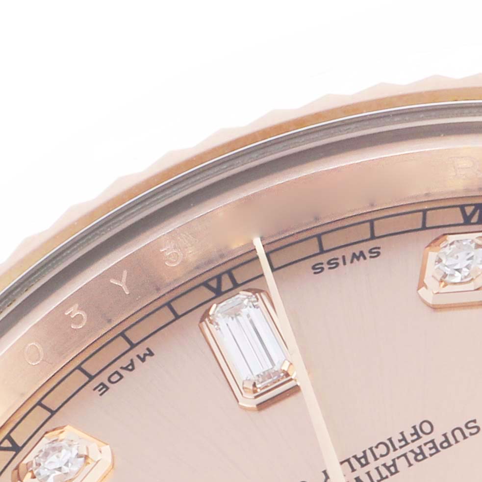 The image shows a close-up of a Rolex President 218235 Men's Rose Gold Pink Dial 218235 Men's Rose Gold Pink Dial watch dial, featuring markers, the second hand, and part of the bezel.
