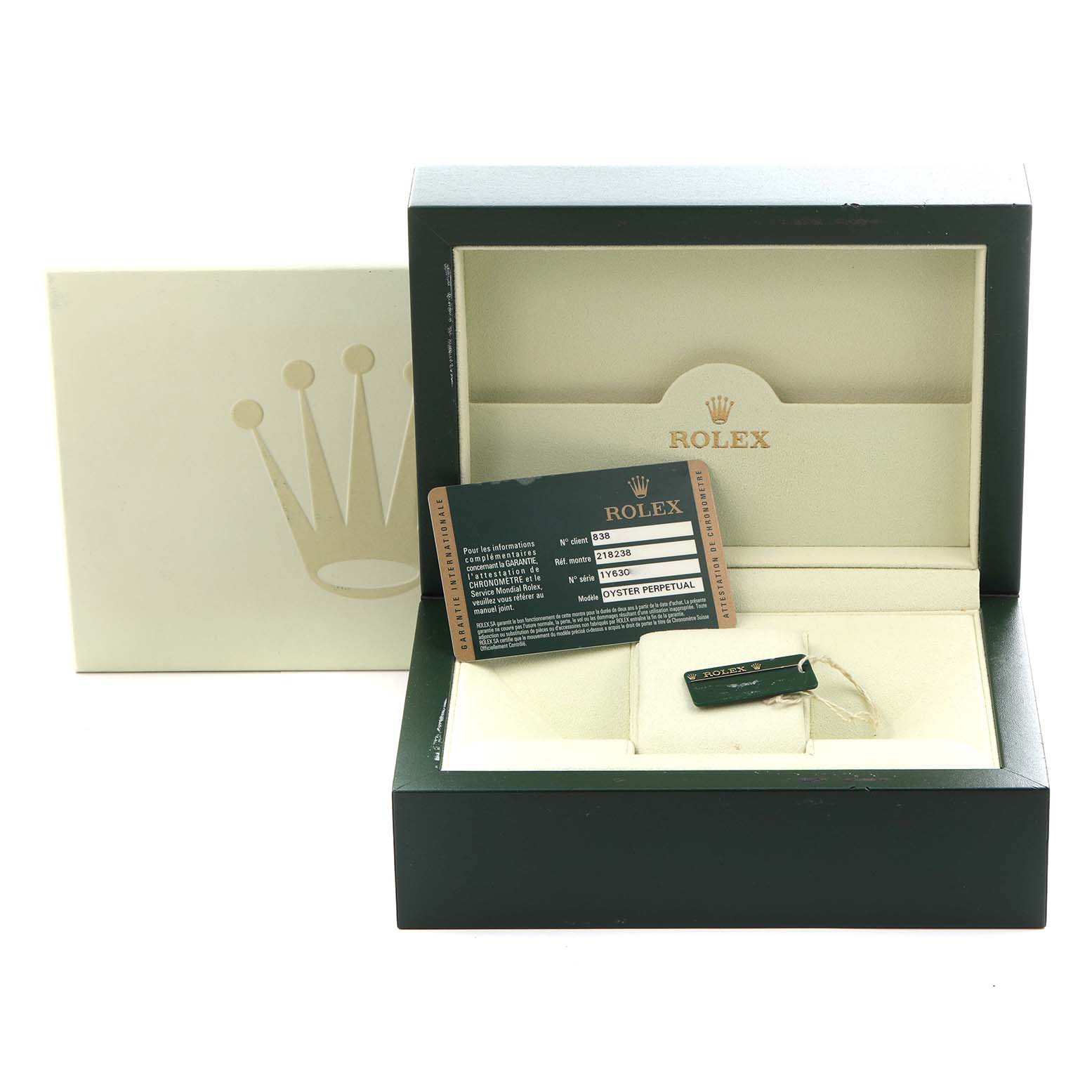 The image shows a Rolex President 218238 Men
s Yellow Gold Silver Dial 218238 Men
s Yellow Gold Silver Dial model box with an open lid, warranty card, and a tag inside.