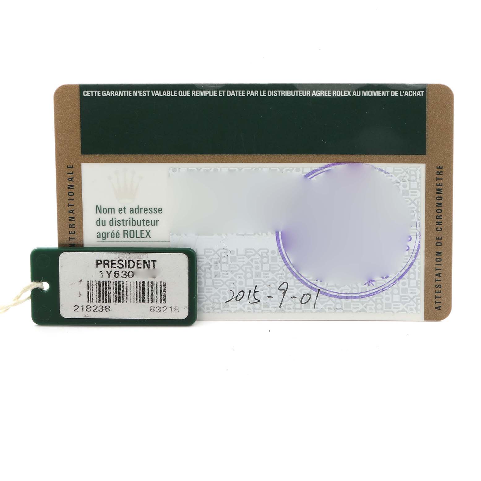 The image shows a Rolex President 218238 Men
s Yellow Gold Silver Dial 218238 Men
s Yellow Gold Silver Dial model warranty card and a tag labeled with the model
s information.